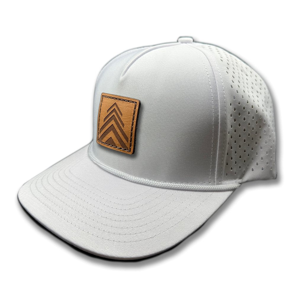 Side view of the Arrow Pine Hat by Outer Wings in white, highlighting the structured high-profile design, classic rope detail, and the distinctive square patch with a triple arrow pine tree motif. The hat's water-resistant fabric and adjustable snapback closure make it ideal for adventurous activities.