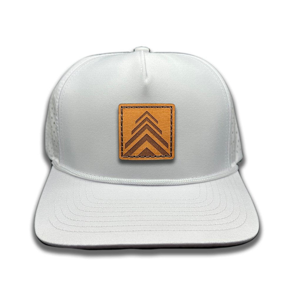 Front view of the Arrow Pine Hat by Outer Wings in white, featuring a high-profile Outer Wings 970 hat with a square leather patch showcasing a triple arrow design resembling a pine tree. The hat is made from durable, water-resistant fabric, with a structured build and classic rope detail, perfect for outdoor enthusiasts.