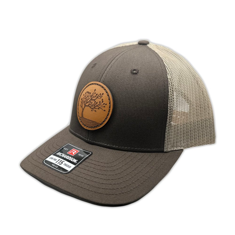 Side view of the Blossom Leather Patch Hat by Outer Wings in brown/khaki, showing the hat’s structured low-profile fit and adjustable SnapBack closure. The detailed Blossom leather patch is hand-sewn for durability and style.