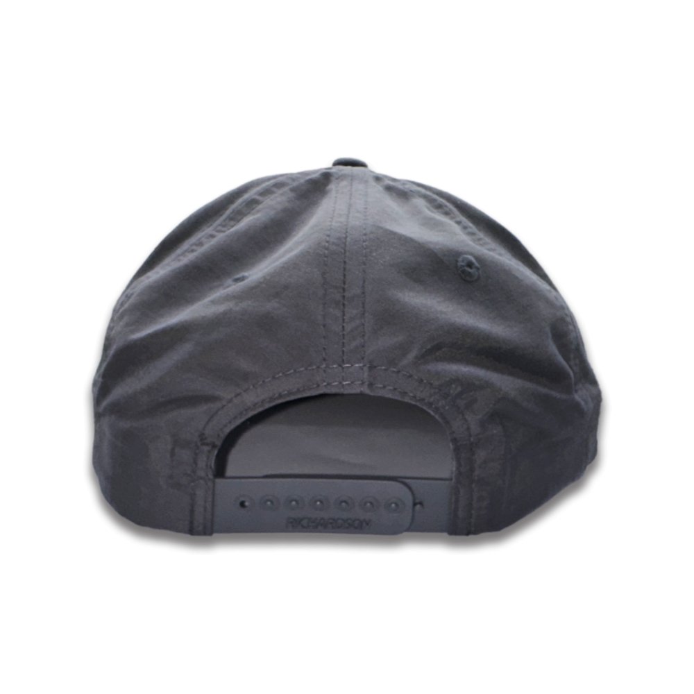 A SnapBack Richardson hat features an adjustable design that allows for a customizable fit. The hat is equipped with plastic snaps on the back, which can be easily adjusted to different sizes by snapping or unsnapping them. This adjustable feature ensures a secure and comfortable fit for various head sizes, making the SnapBack Richardson hat a versatile and practical choice for anyone looking for a personalized fit.