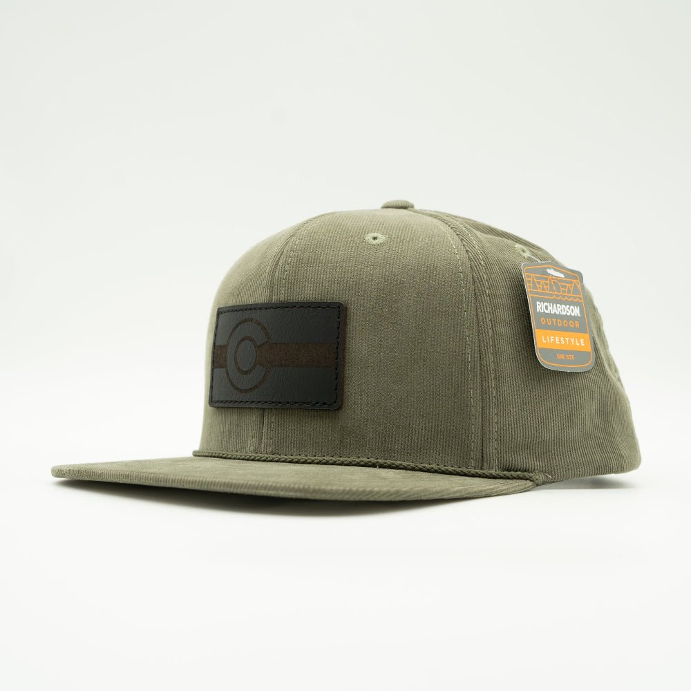 Side view of olive Richardson 253 men’s corduroy hat with black Colorado leather patch, flat bill and soft high-profile fit.

Color: Olive 253 (OSFM)