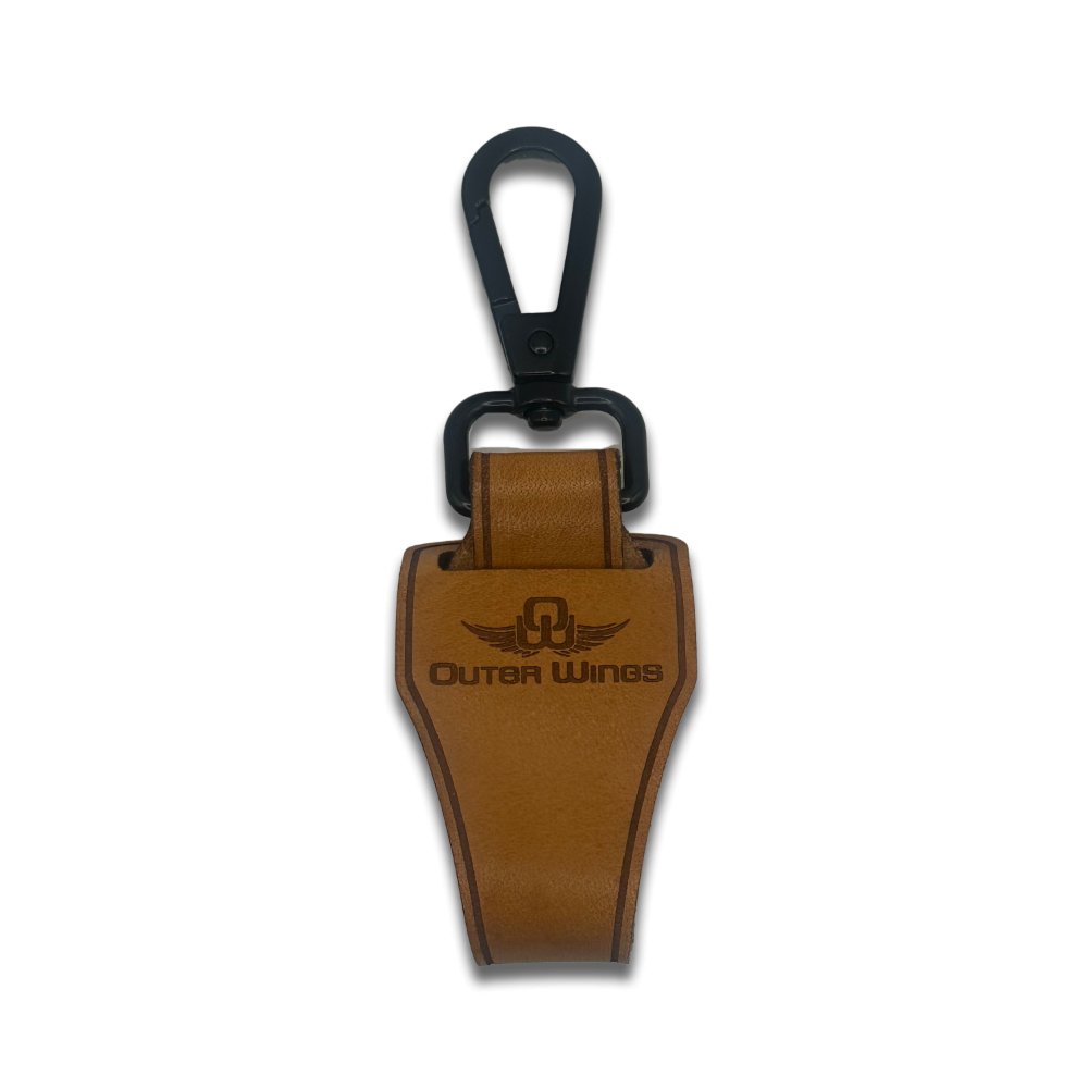 Outer Wings leather hat clip shown in a closed position, highlighting the compact design with a thick leather loop, secured with Chicago rivets, and a quick link keychain. The closed clip demonstrates its secure and stylish functionality for hat carrying.