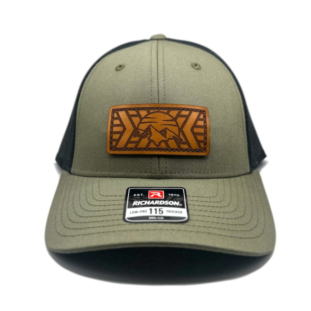 Front view of the Mosaic Mountain Leather Patch Hat by Outer Wings in loden/black, featuring a laser-engraved leather patch on a low profile Richardson 115 hat. This custom leather patch hat combines a sleek, structured design with outdoor-inspired style, perfect as a versatile outdoors hat for hiking, camping, or casual wear.