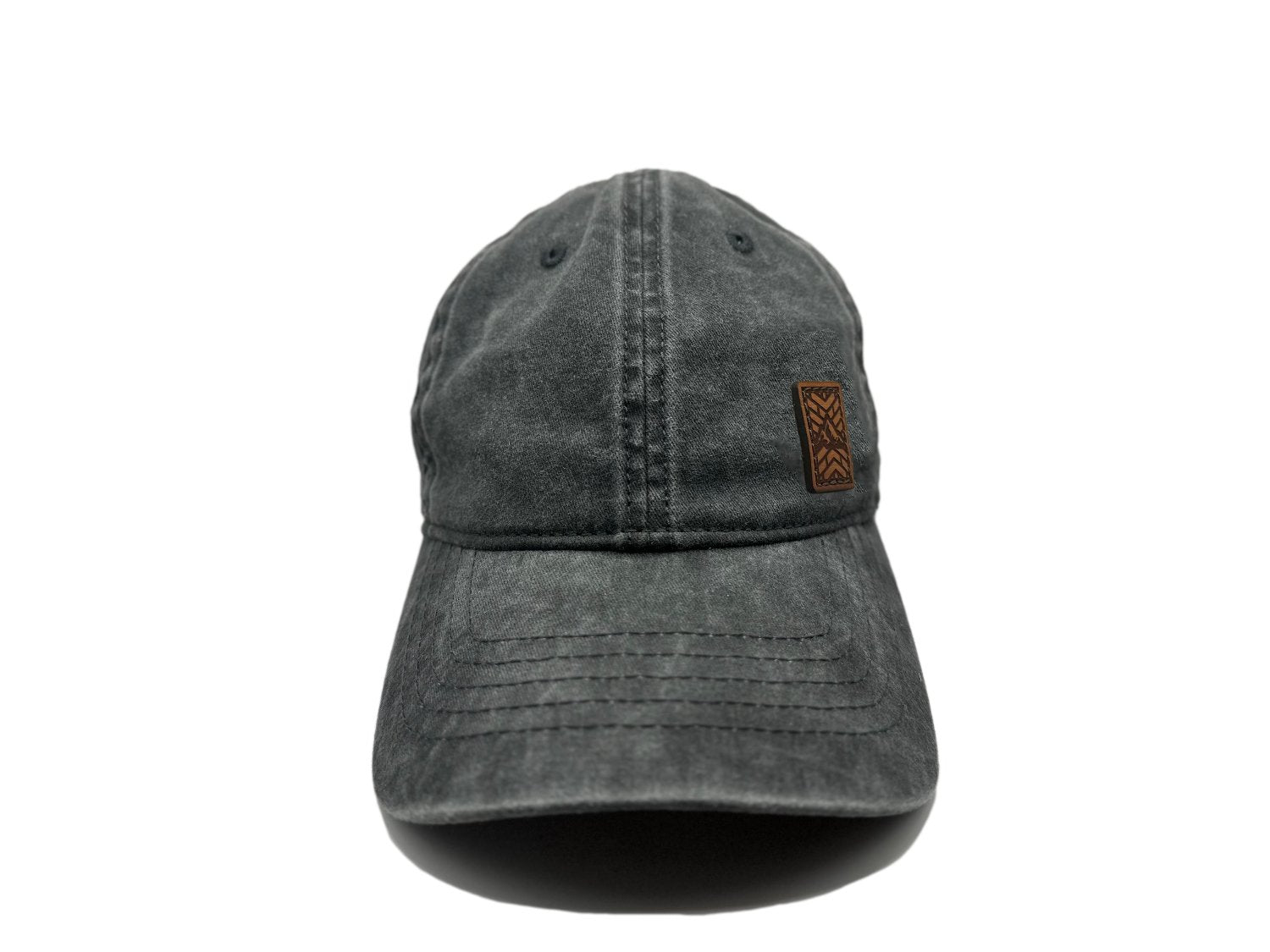 Women's baseball hat with leather patch. Our custom designed leather patch is laser engraved and sewn onto a women's cap. We use full-grain, veg tanned leather. Women's hats have a hidden pony tail opening and makeup resistant band.