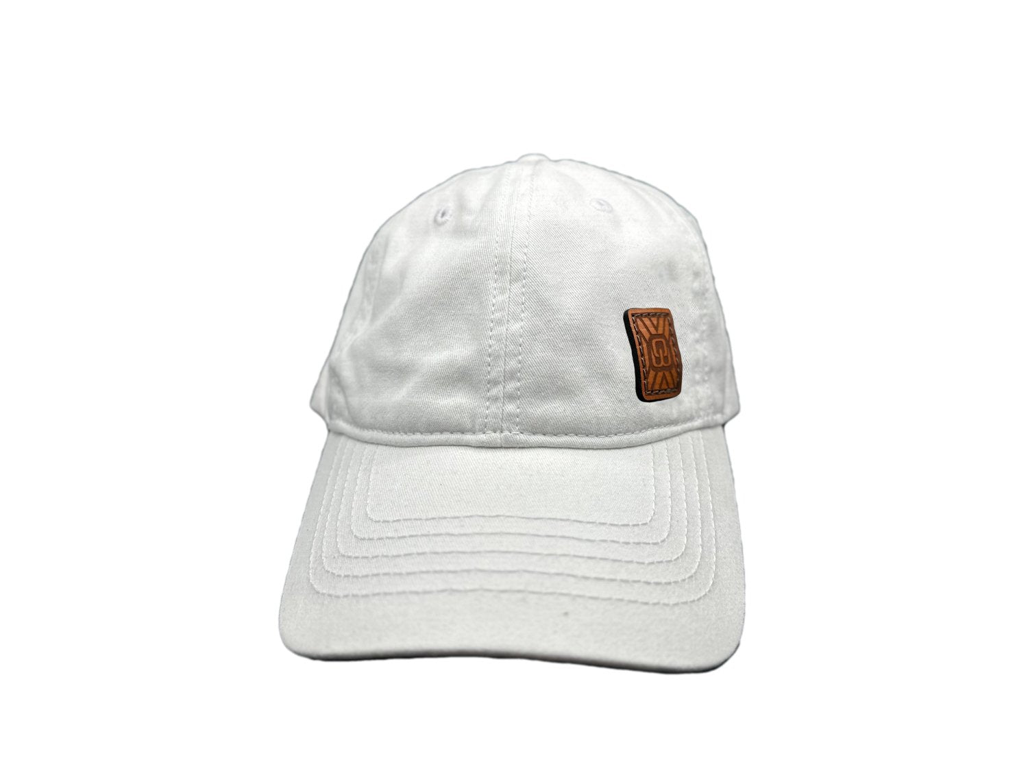 Women's baseball hat with leather patch. Our custom designed leather patch is laser engraved and sewn onto a women's cap. We use full-grain, veg tanned leather. Women's hats have a hidden pony tail opening and makeup resistant band.