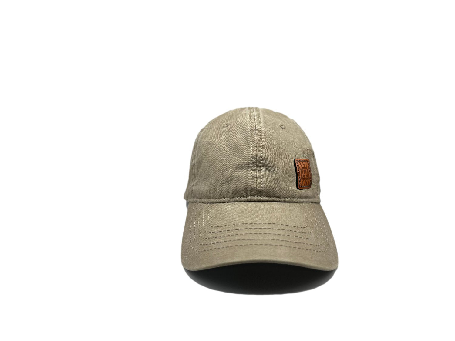 Women's baseball hat with leather patch. Our custom designed leather patch is laser engraved and sewn onto a women's cap. We use full-grain, veg tanned leather. Women's hats have a hidden pony tail opening and makeup resistant band.