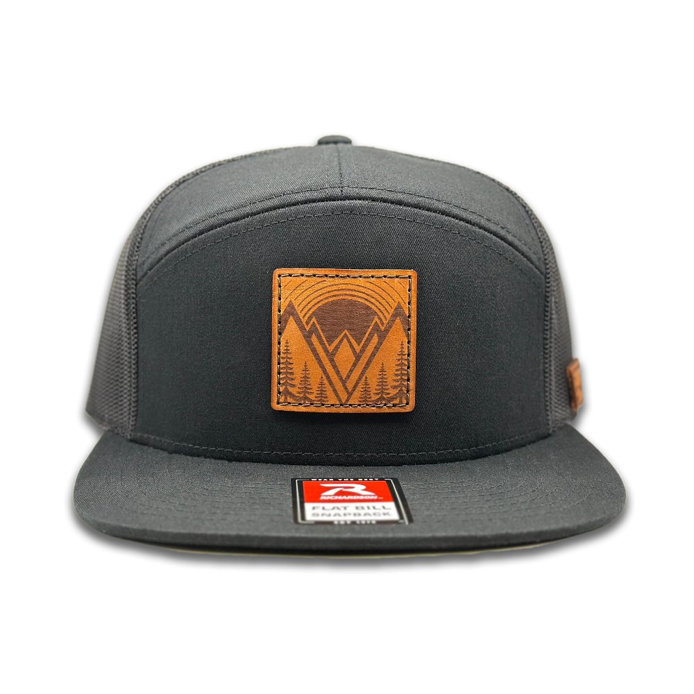 Front view of the Richardson 168 Flat-Bill Trucker Hat in black, featuring a high-profile, seven-panel structured design. This flat bill hat has a cotton/nylon/polyester blend front and a breathable polyester mesh back with an adjustable SnapBack closure, perfect for outdoor and casual wear