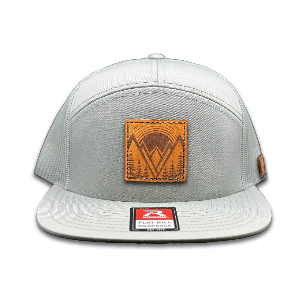 Front view of the Richardson 168 Flat-Bill Trucker Hat in quarry, featuring a high-profile, seven-panel design with a flat bill. The hat combines a cotton/nylon/polyester blend front with a mesh back and adjustable SnapBack closure, ideal for both outdoor activities and casual use.