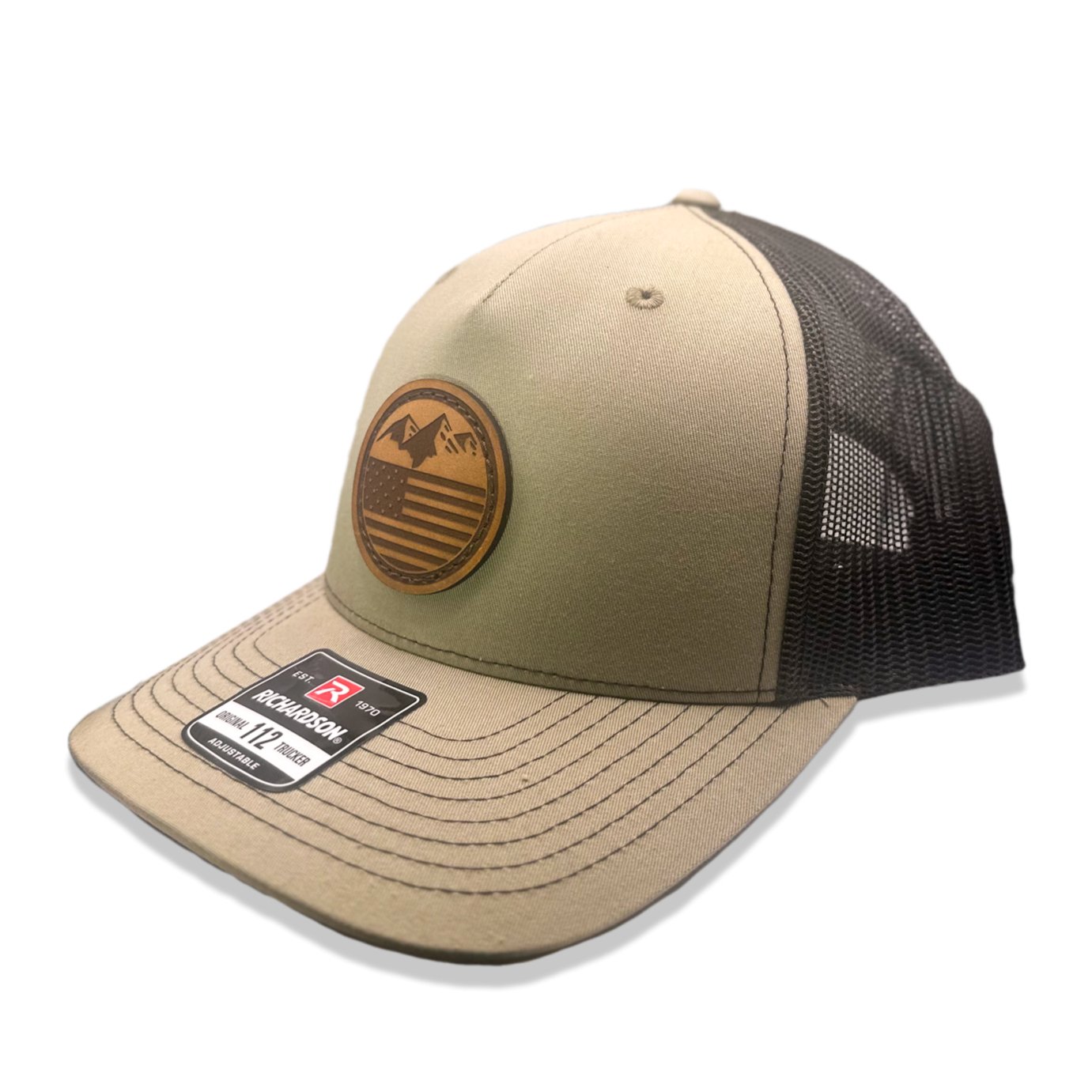 Side view of the Mountain Flag leather patch hat on Richardson 112FP in Khaki/Coffee, showcasing the flat bill, adjustable snapback closure, and seamless front panel. A versatile outdoors hat for every adventure