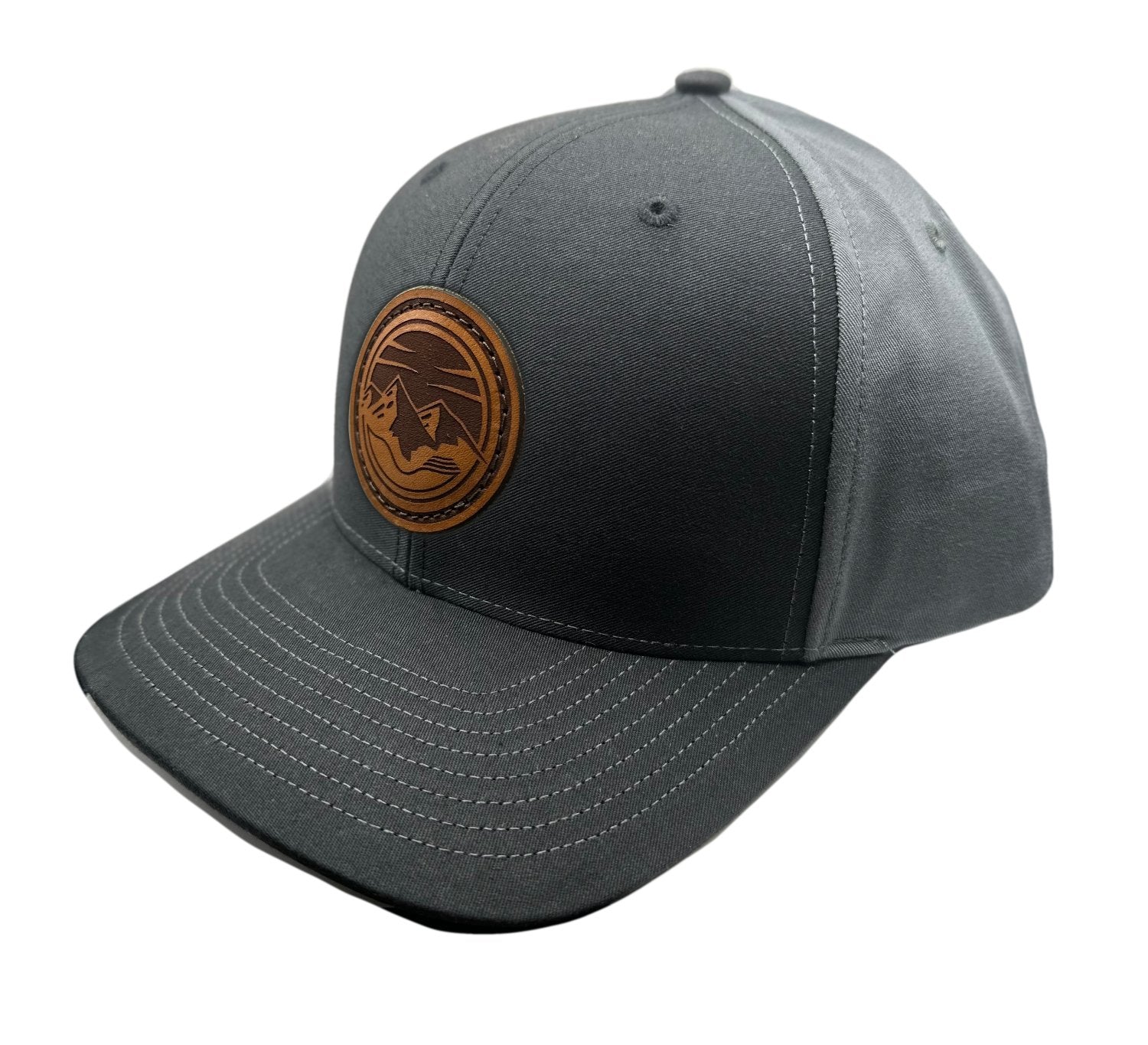 Side view of the Mountain Lake leather patch hat on Richardson 312 in Black/Charcoal, highlighting the pre-curved visor, adjustable snapback closure, and full-fabric front. A perfect custom leather patch hat for mountain man apparel.