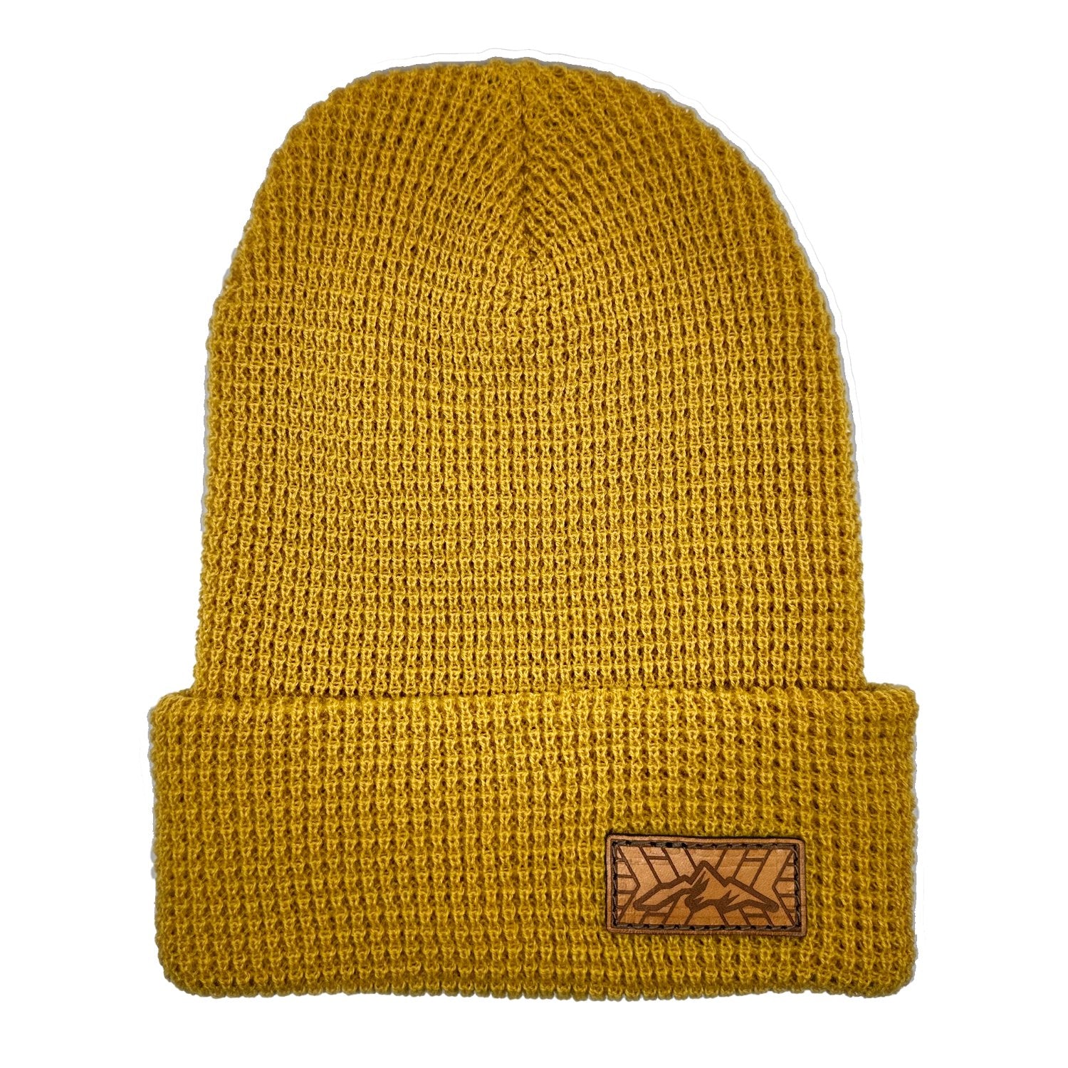 Leather patch beanie. Mustard color stocking cap. We have sewn on a leather patch that is Full grain, Veg tanned, High-quality leather. The Mountain Top image is laser engraved. Handmade in USA patch, stitched onto a Richardson yellow Beanie.