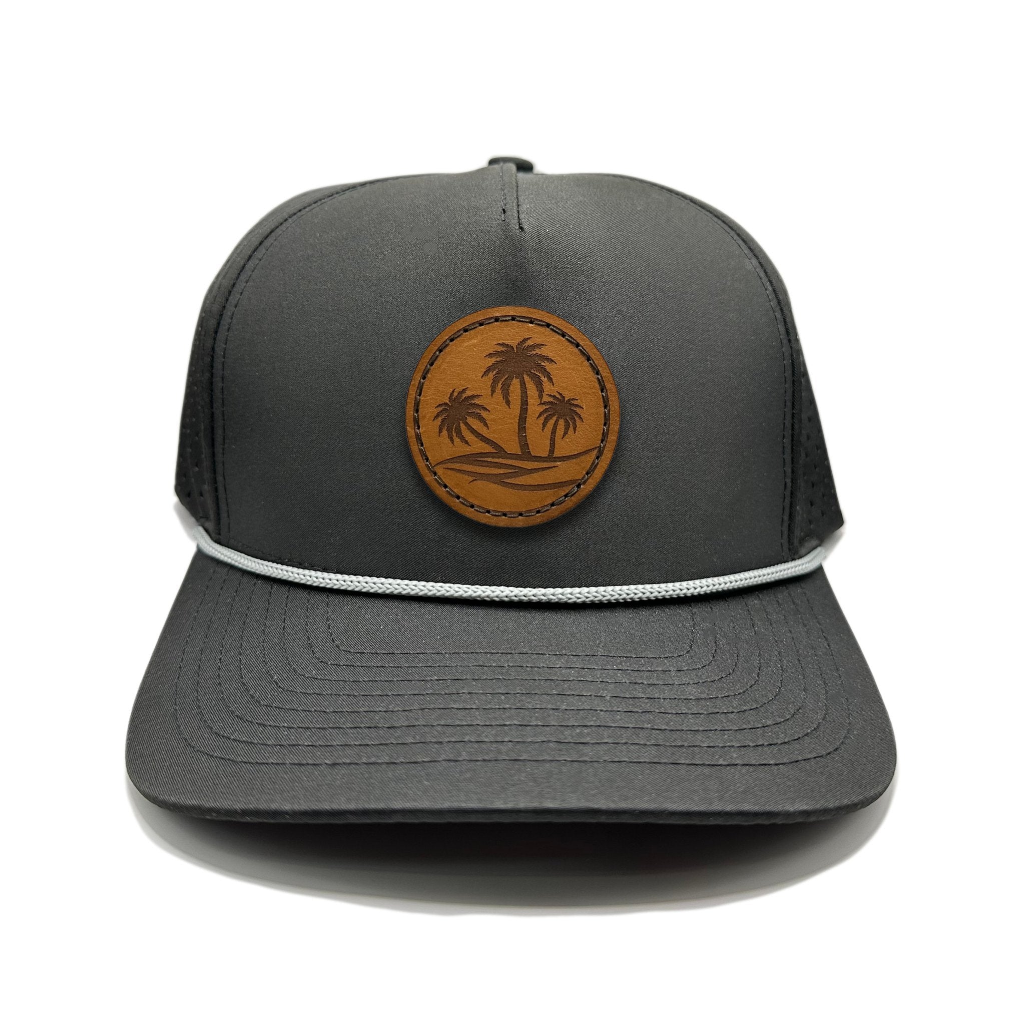 Front view of the Oasis Hat by Outer Wings in black, crafted on a high-profile Outer Wings 970 hat with a round patch featuring three palm trees. This custom leather patch hat combines rugged durability with a coastal vibe.