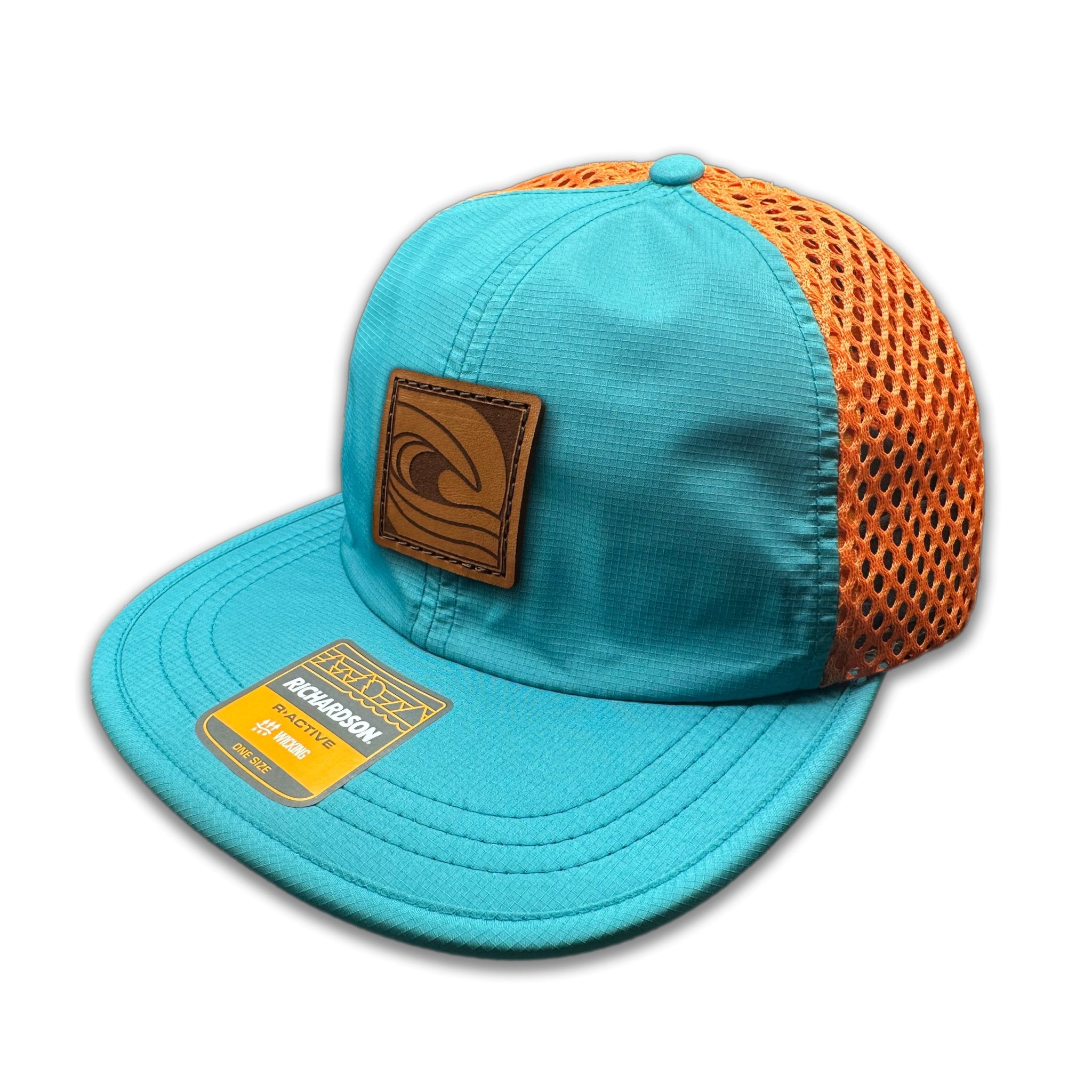 Side view of the Ocean Swell Hat by Outer Wings in Teal/Orange, showing the wide-set mesh back, adjustable backstrap, and flexible visor. A lightweight, breathable outdoors hat for any adventure.