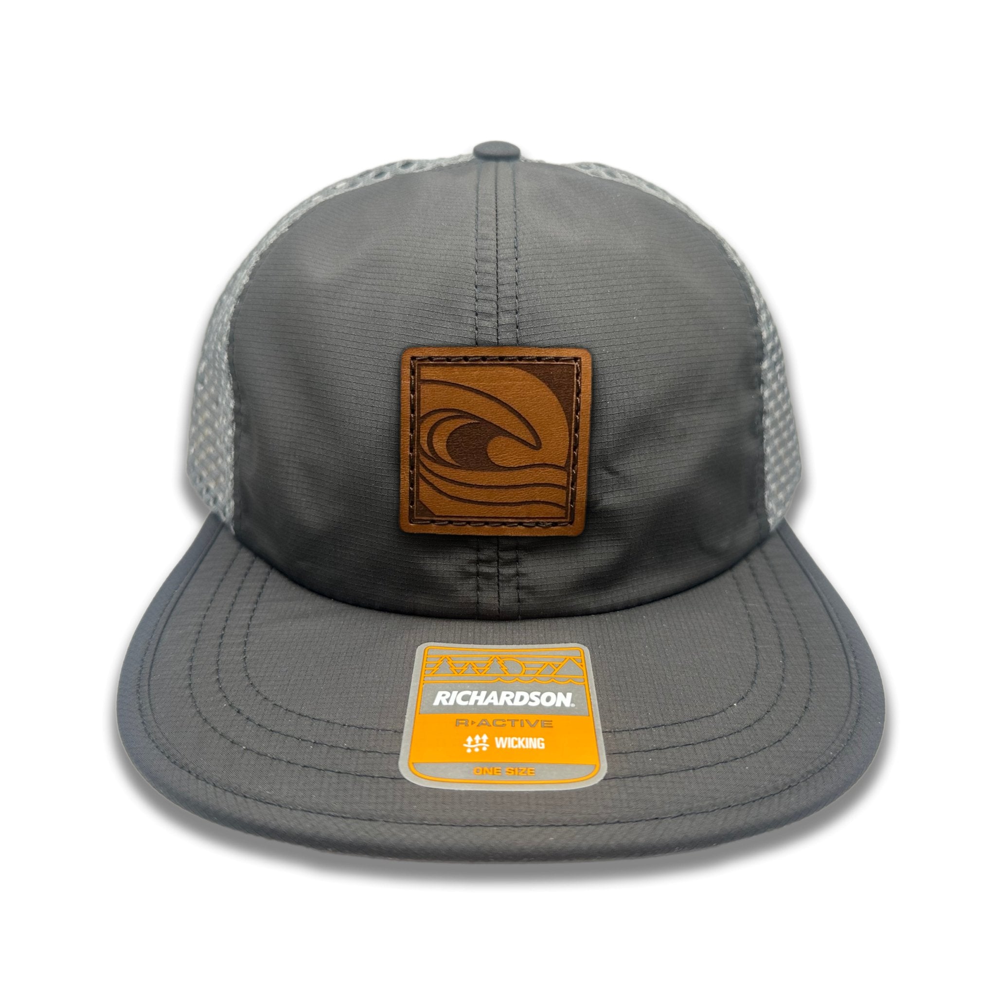 Front view of the Ocean Swell Hat by Outer Wings in Black/Charcoal, featuring a low profile, six-panel Richardson 935 hat with a square patch showcasing an ocean wave design. Perfect for outdoor enthusiasts and beach lovers.