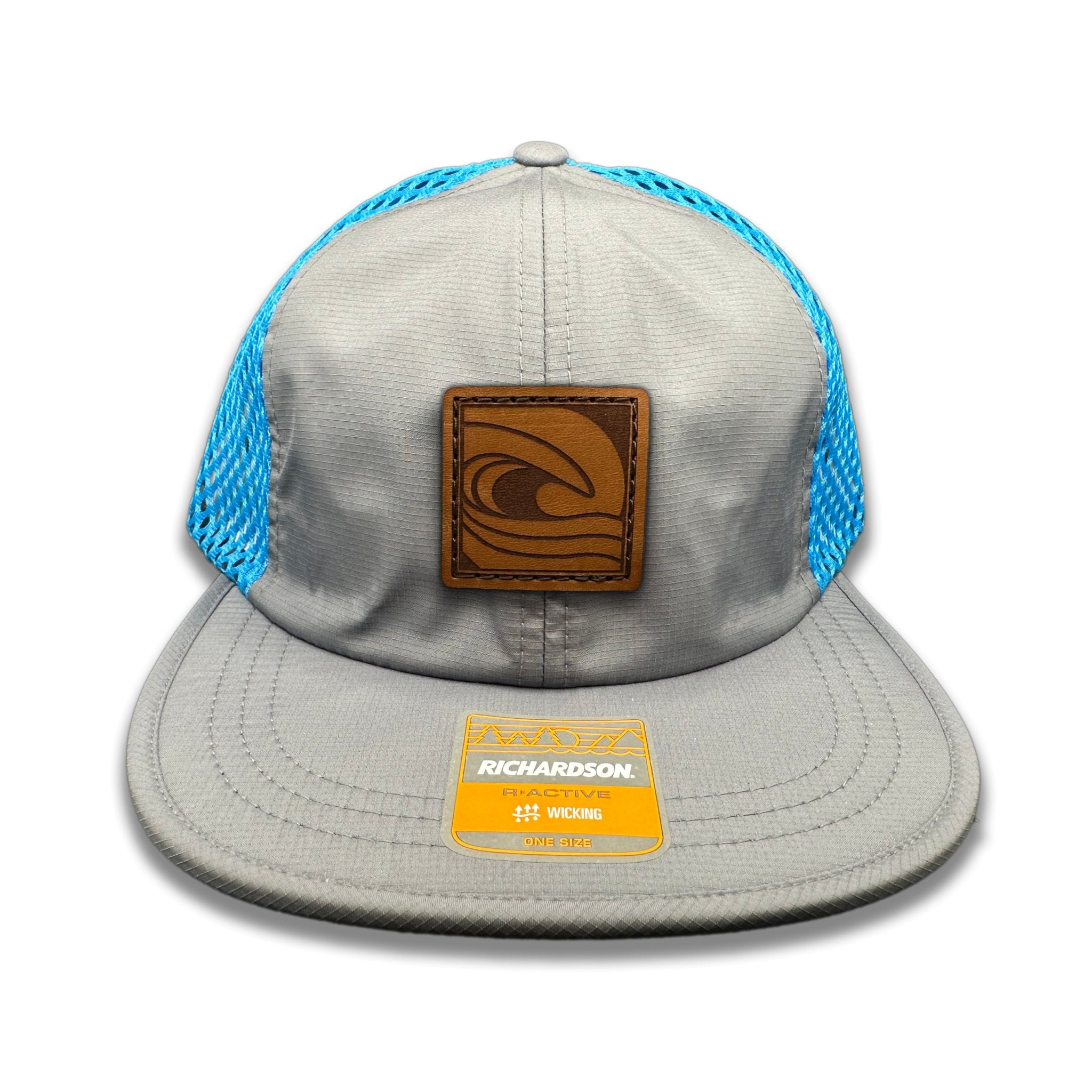 Front view of the Ocean Swell Hat by Outer Wings in Charcoal/Cyan, featuring a low profile, unstructured Richardson 935 with a bold ocean wave patch. Ideal for outdoor enthusiasts and coastal adventures.