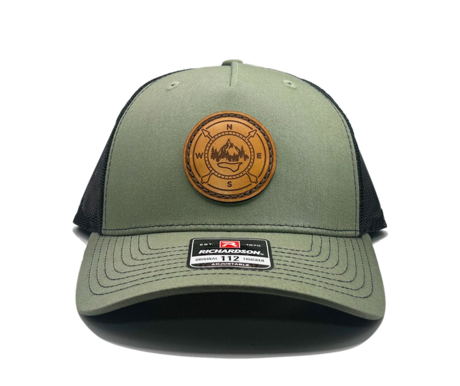 Front view of the Outdoor Compass Leather Patch Hat by Outer Wings in Loden/Black, featuring a mid-profile, structured Richardson 112FP with a genuine leather patch and Outdoor Compass design. A must-have for outdoor enthusiasts and mountain man apparel lovers.