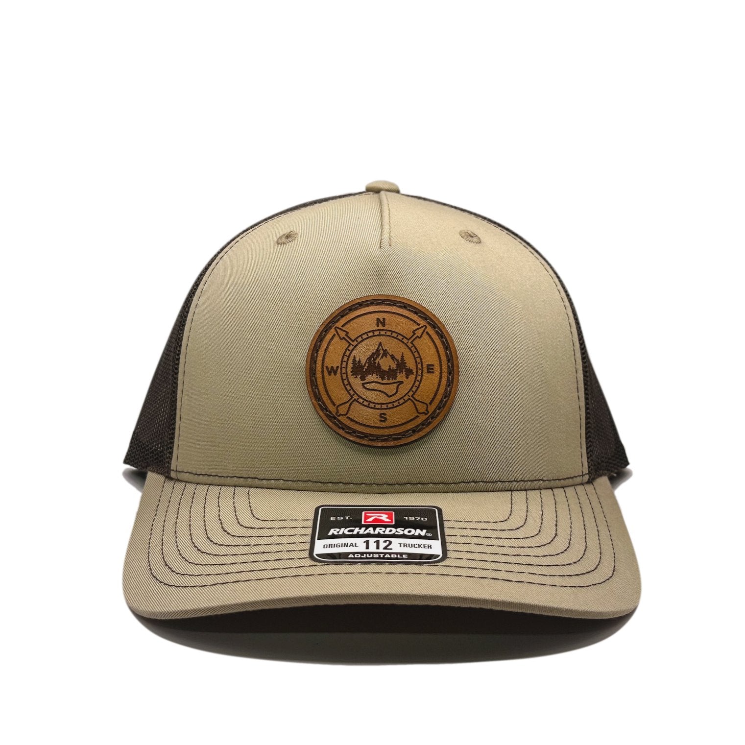 Front view of the Outdoor Compass Leather Patch Hat by Outer Wings in Khaki/Coffee, crafted on a mid-profile Richardson 112FP with a round leather patch featuring a laser-engraved Outdoor Compass design. Perfect for hiking, camping, and everyday wear