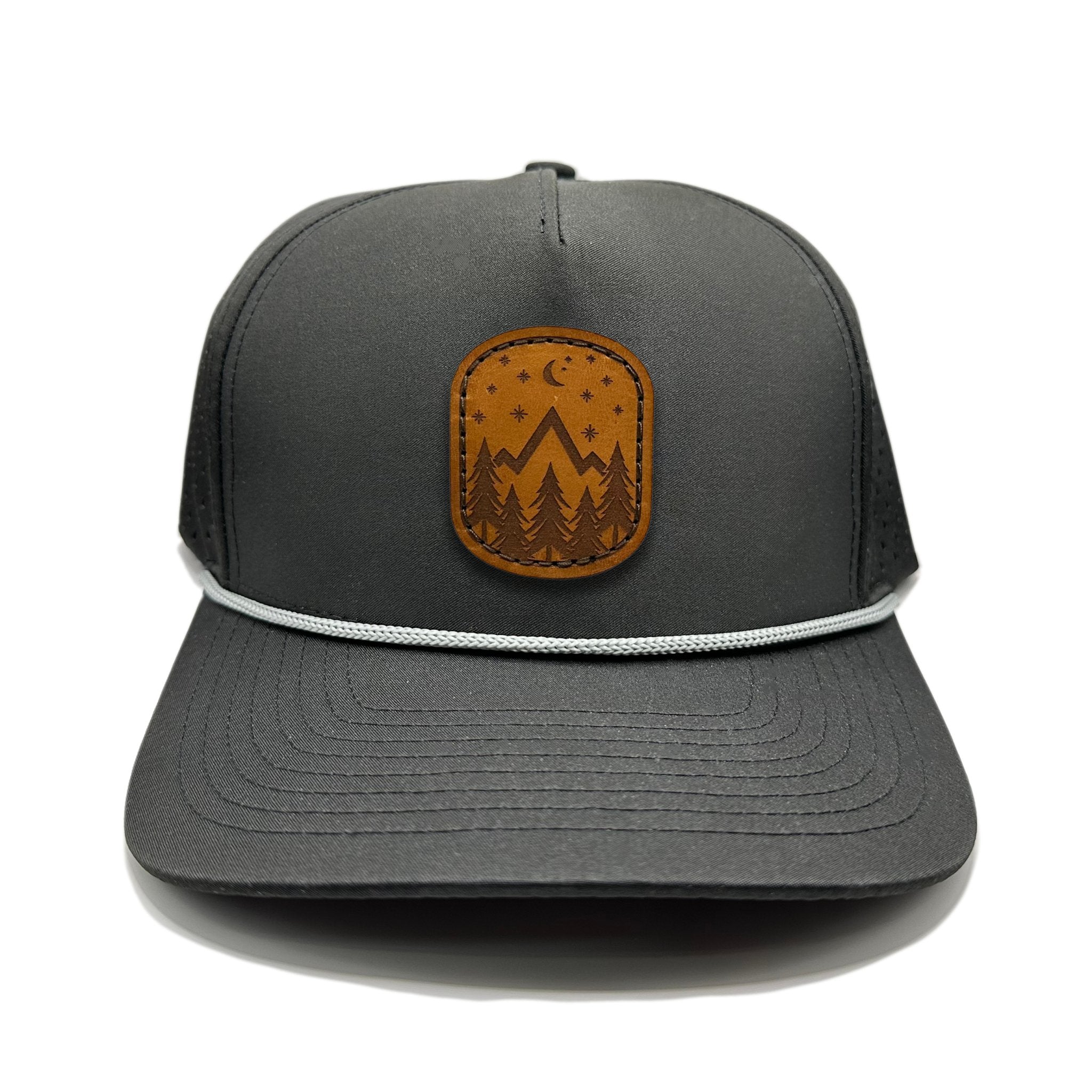 Front view of the Starry Night Leather Patch Hat by Outer Wings in Black, crafted on a high-profile, five-panel Outer Wings 970 with a laser-engraved leather patch featuring mountains, pine trees, stars, and a half moon. Perfect for outdoor enthusiasts and nighttime adventures.