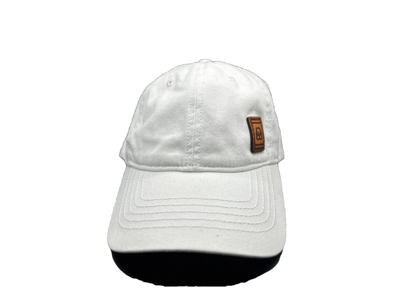 Women's baseball hat with leather patch. Our custom designed leather patch is laser engraved and sewn onto a women's cap. We use full-grain, veg tanned leather. Women's hats have a hidden pony tail opening and makeup resistant band.