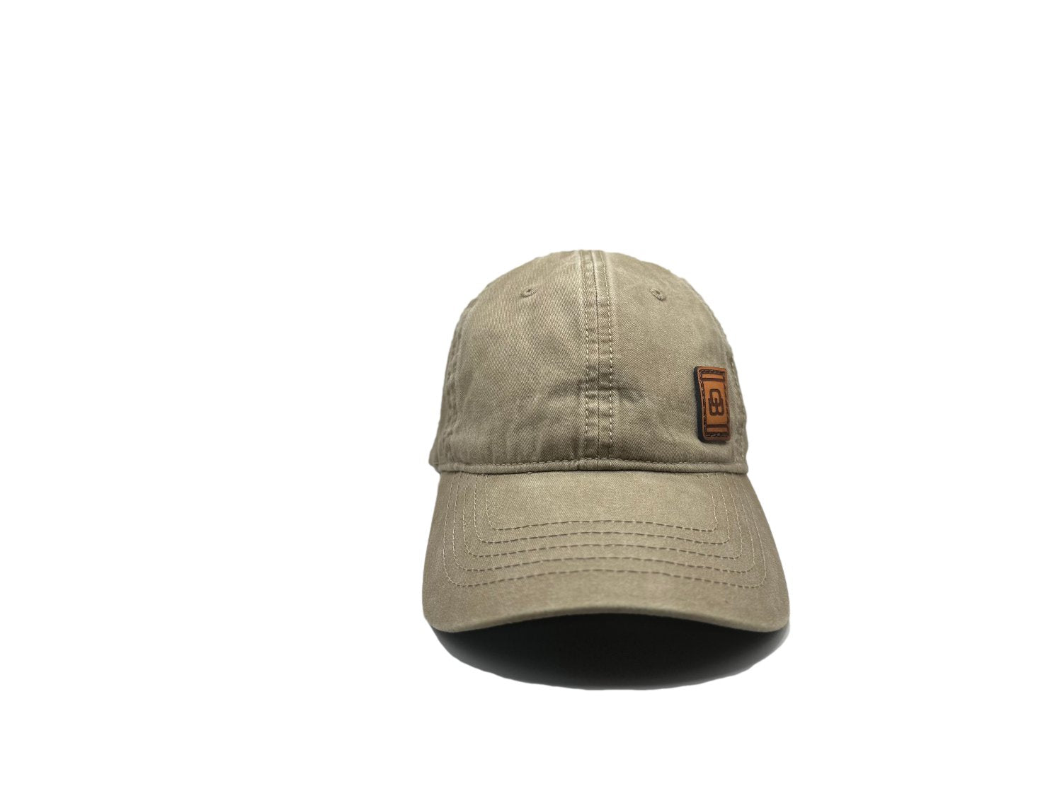 Women's baseball hat with leather patch. Our custom designed leather patch is laser engraved and sewn onto a women's cap. We use full-grain, veg tanned leather. Women's hats have a hidden pony tail opening and makeup resistant band.