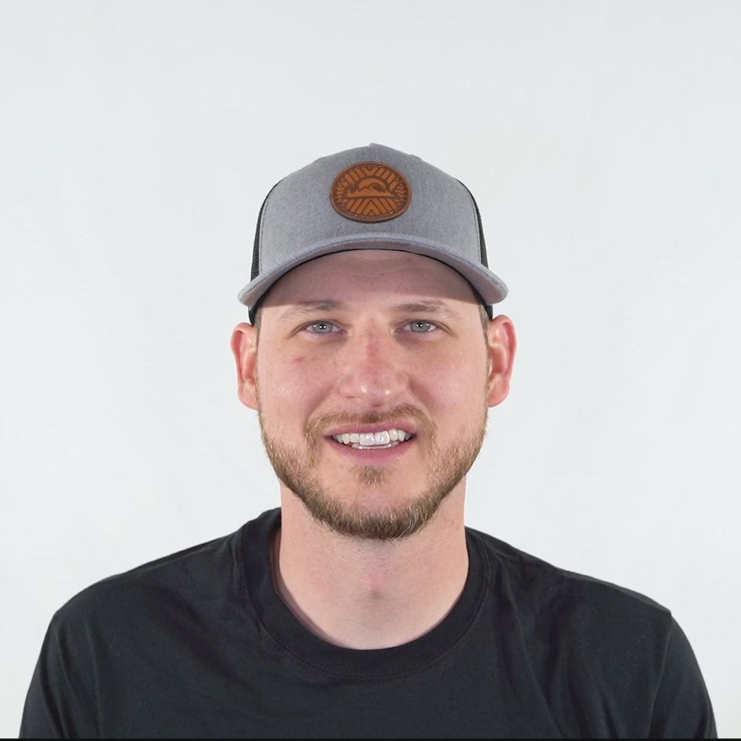Video preview of heather grey/black Richardson 112FP Mosaic Sunset leather patch hat on model, head turning to show fit and profile.
Color: Heather Grey/Black