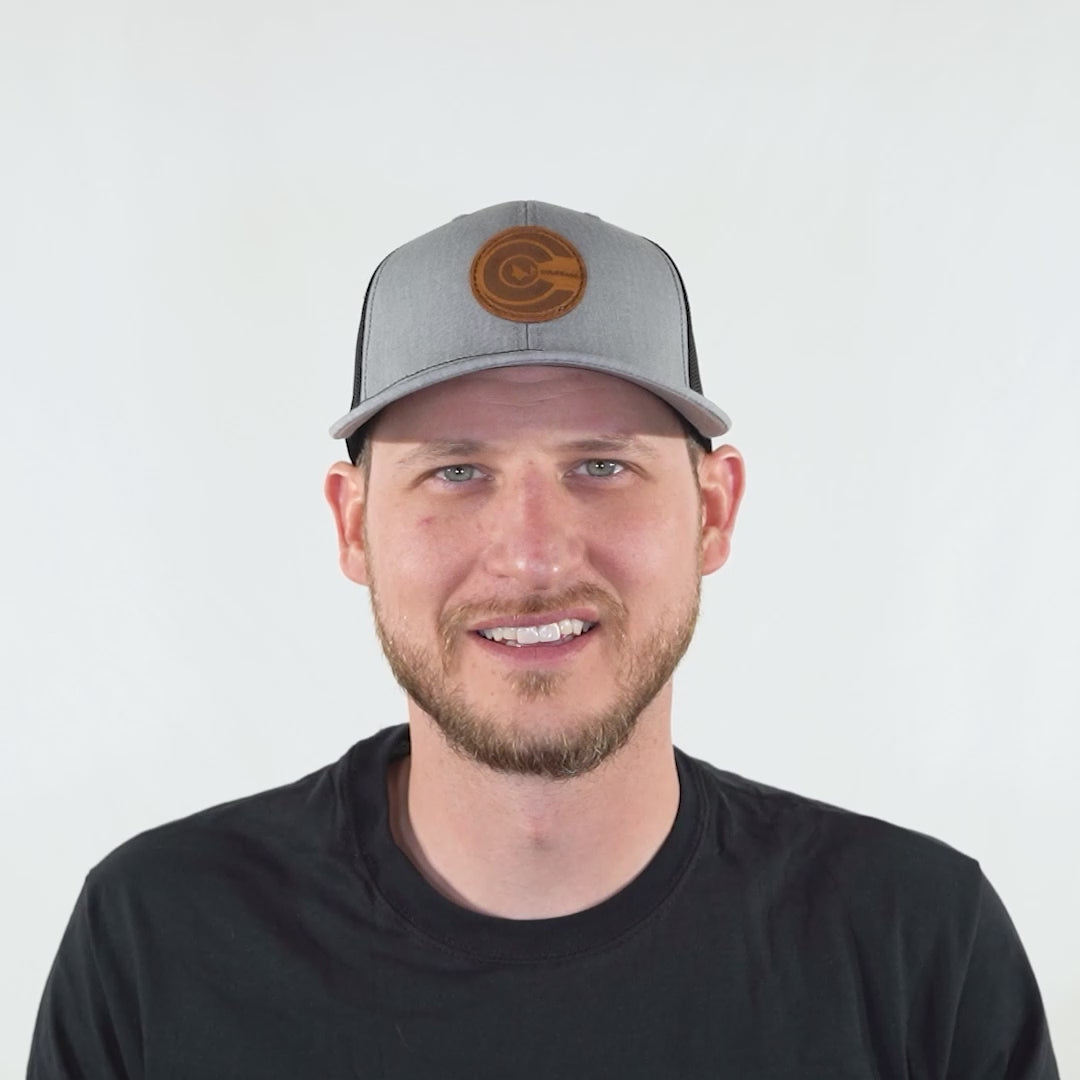 Video of person wearing heather grey and black Richardson 112 trucker hat, rotating head to show leather Colorado flag patch.
Color: Heather Grey/Black