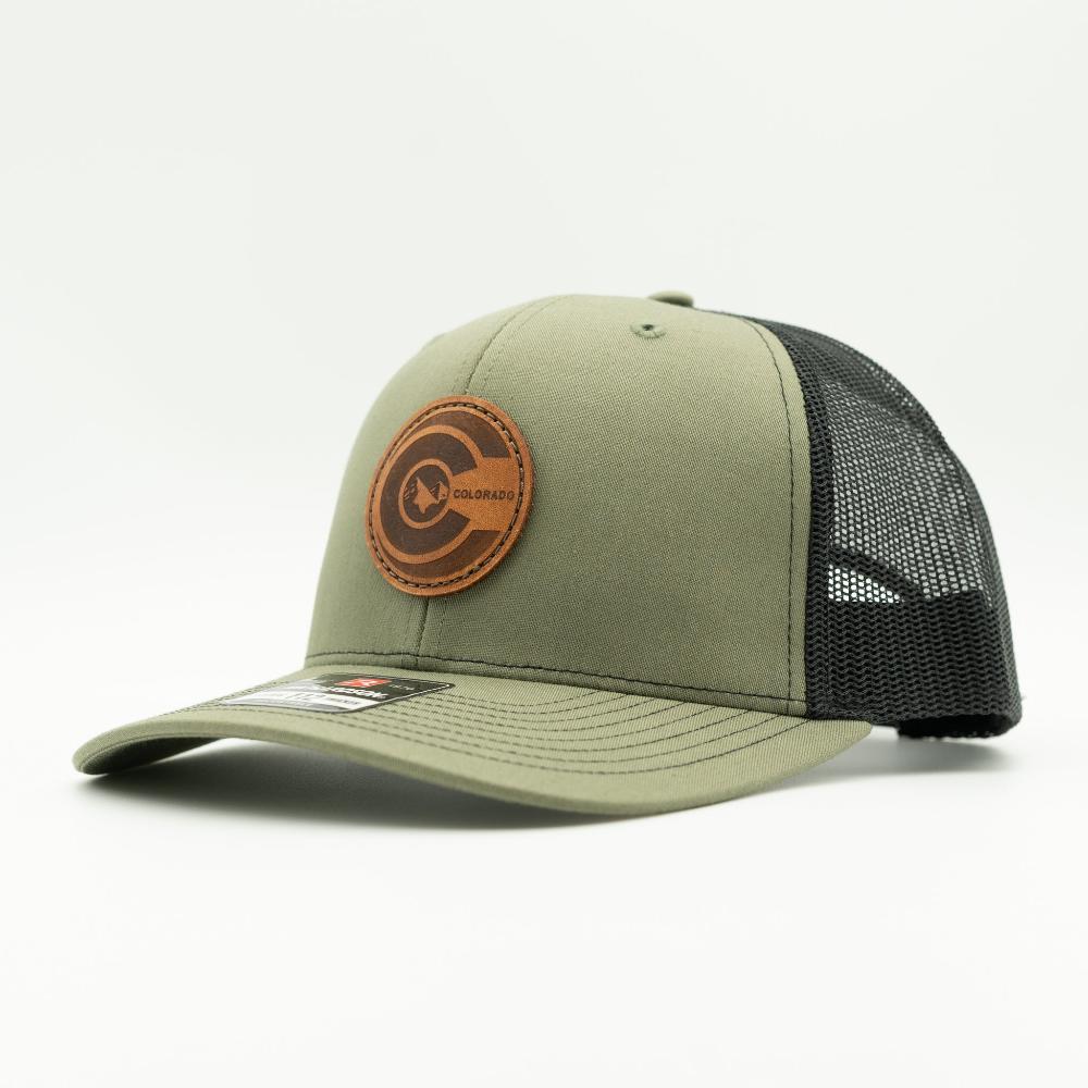Side view of loden green and black Richardson 112 Colorado flag leather patch trucker hat with breathable mesh back.

Color: Loden/Black
