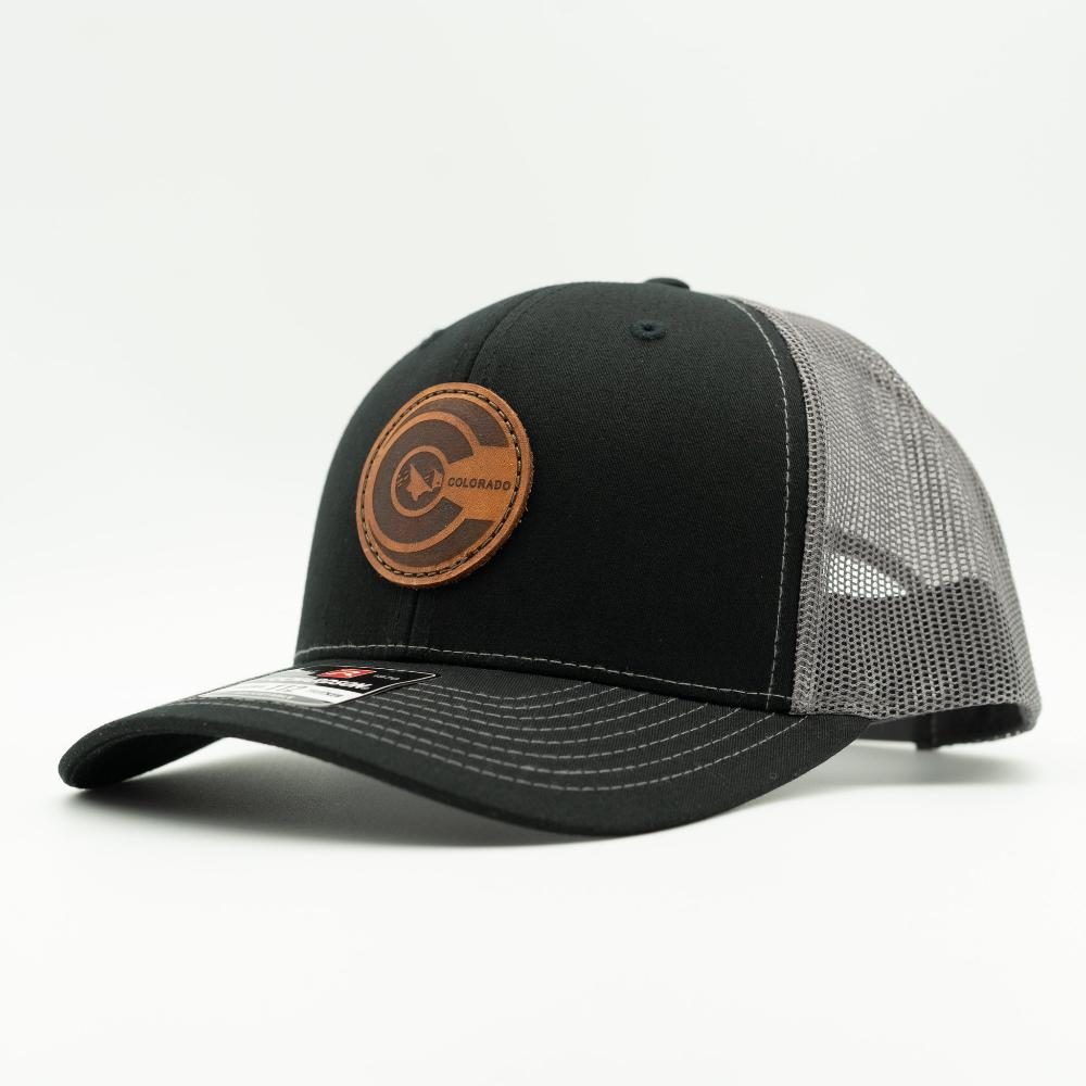 Side view of black and charcoal Richardson 112 Colorado flag leather patch hat with mesh back and curved brim.

Color: Black/Charcoal