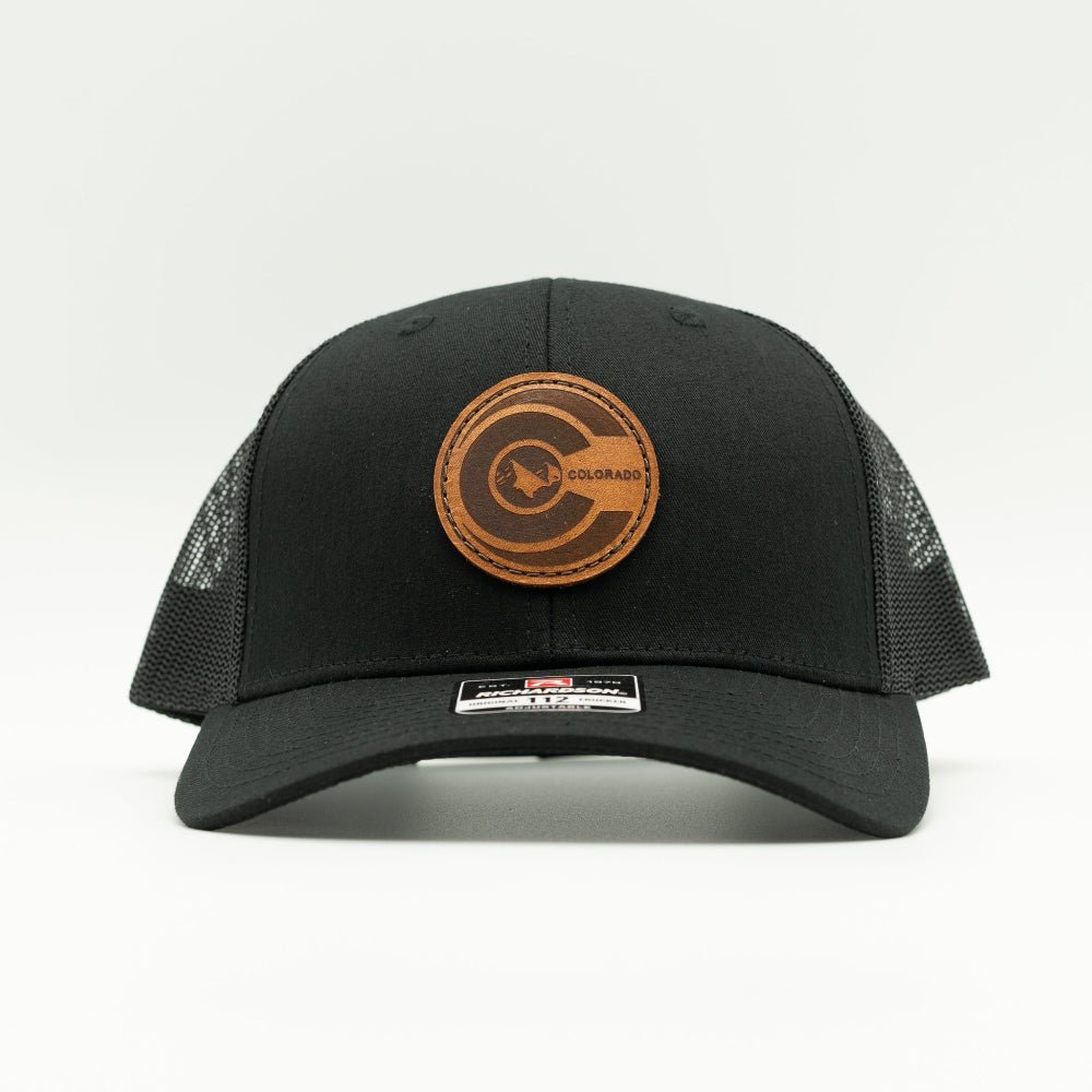Front view of black Richardson 112 mid-profile trucker hat with engraved round leather Colorado flag patch and pre-curved visor.

Color: Solid Black