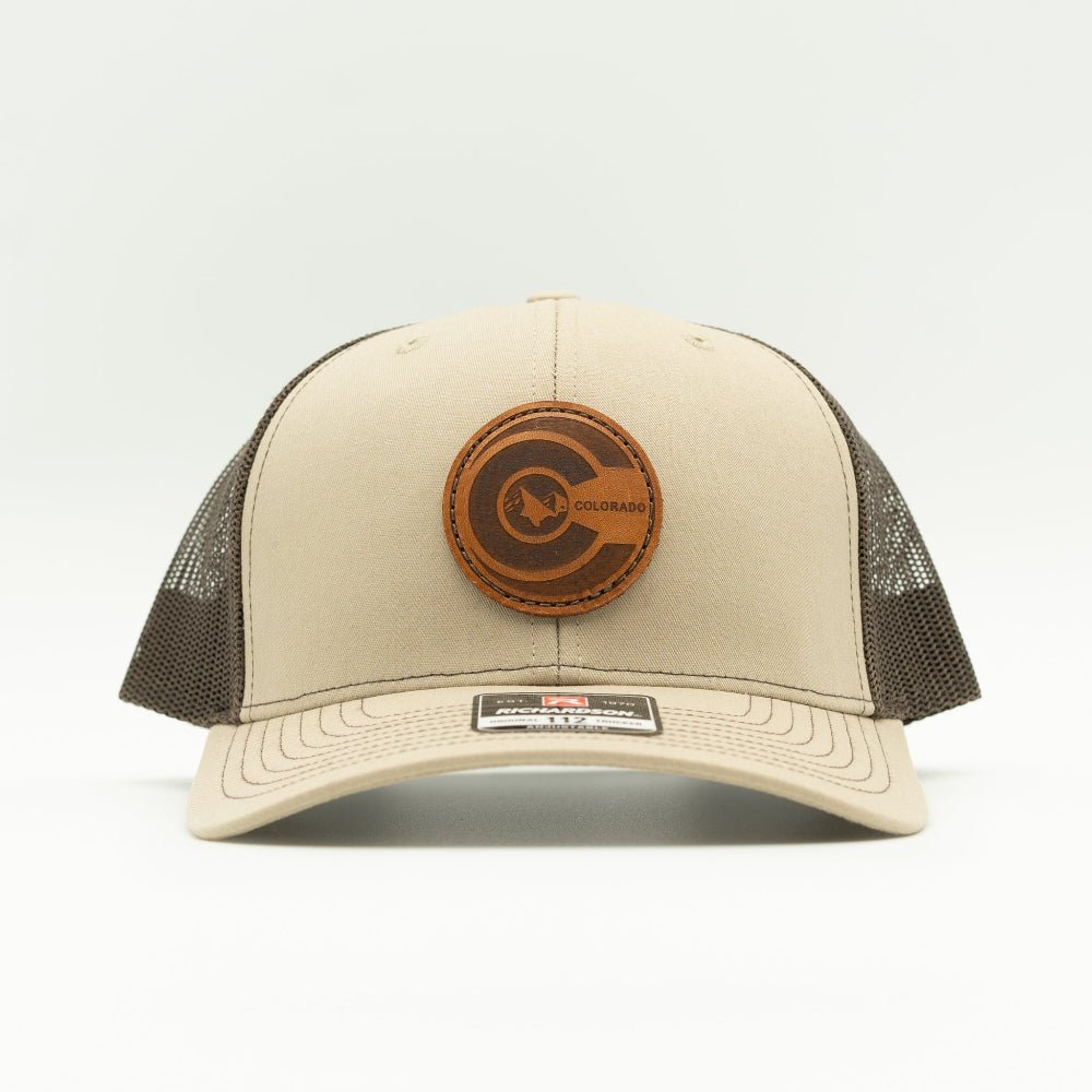 Front view of khaki front, brown mesh Richardson 112 hat featuring round veg-tan leather Colorado flag patch and pre-curved bill.

Color: Khaki/Coffee