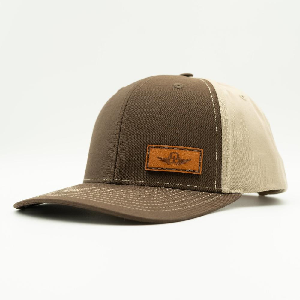 Side view of brown/khaki Richardson 312 hat with Spread Your Wings leather patch, curved bill and structured mid profile.