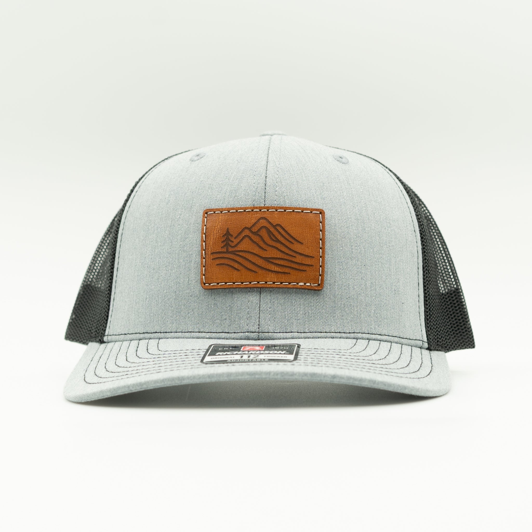 Front view of heather grey and black Richardson 112 Driftline hat with rectangular mountain range leather patch

Color: Heather Grey/Black