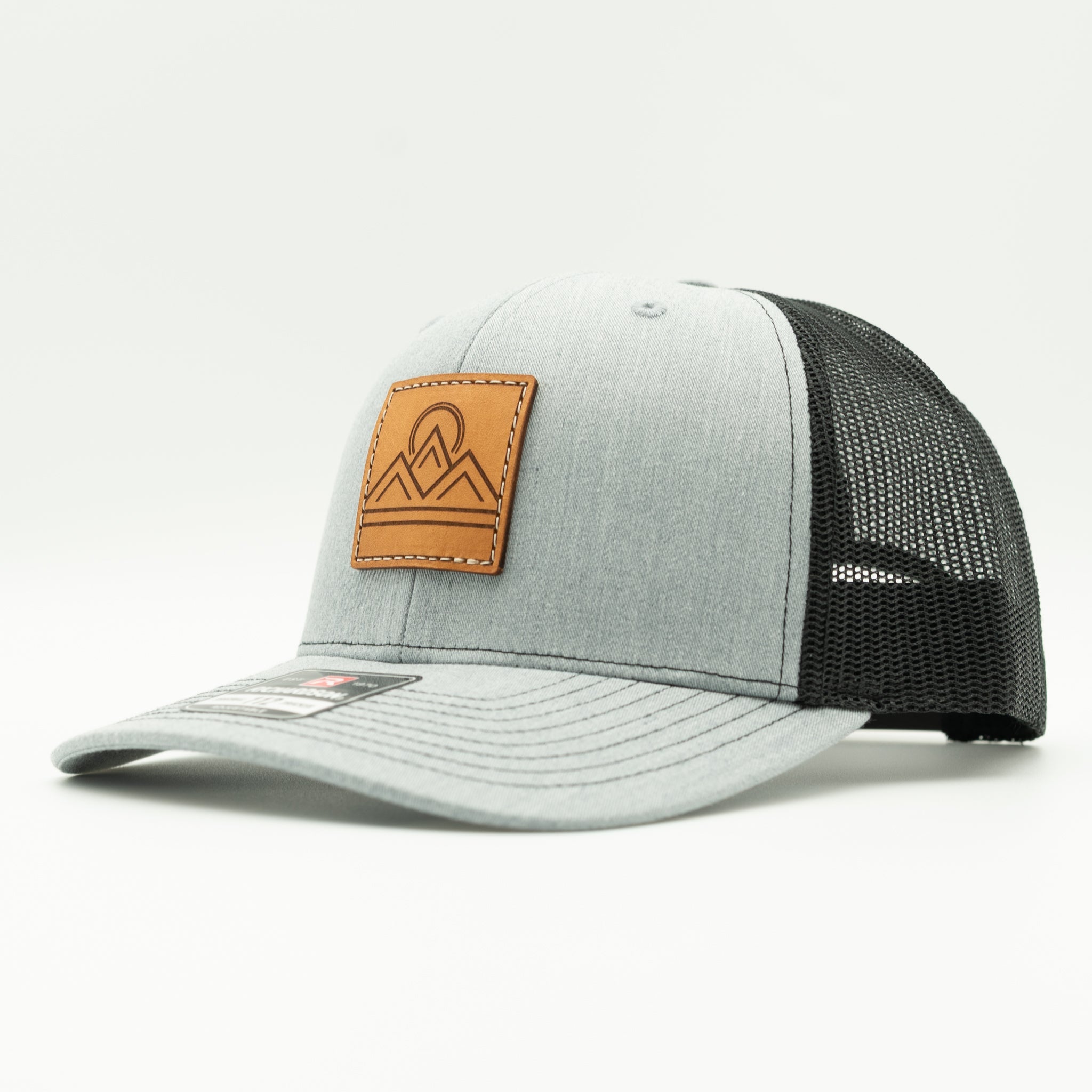 Side view of Lunar Ridge heather grey and black Richardson 112 leather patch mountain hat with black mesh

Color: Heather Grey/Black