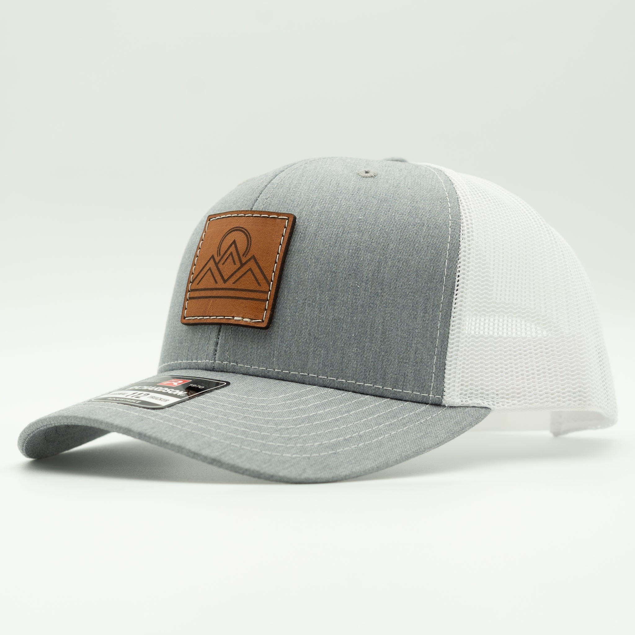 Side view of Lunar Ridge heather grey and white Richardson 112 leather patch mountain hat with white mesh back

Color: Heather Grey/White