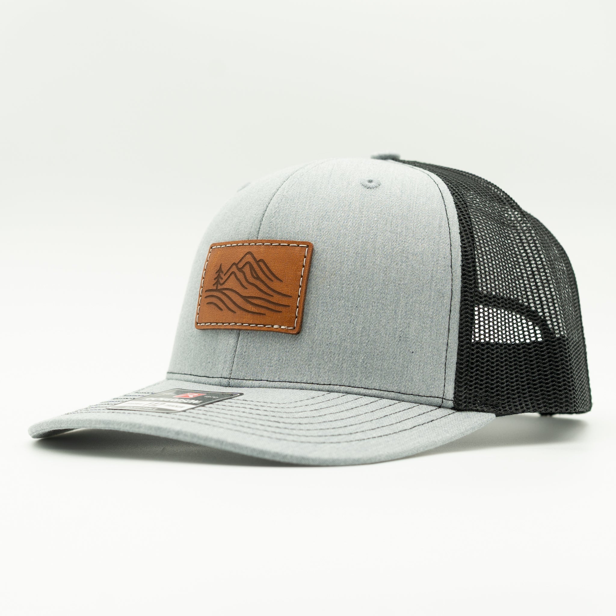 Side view of heather grey and black Richardson 112 Driftline leather patch hat, casual mountain trucker style

Color: Heather Grey/Black
