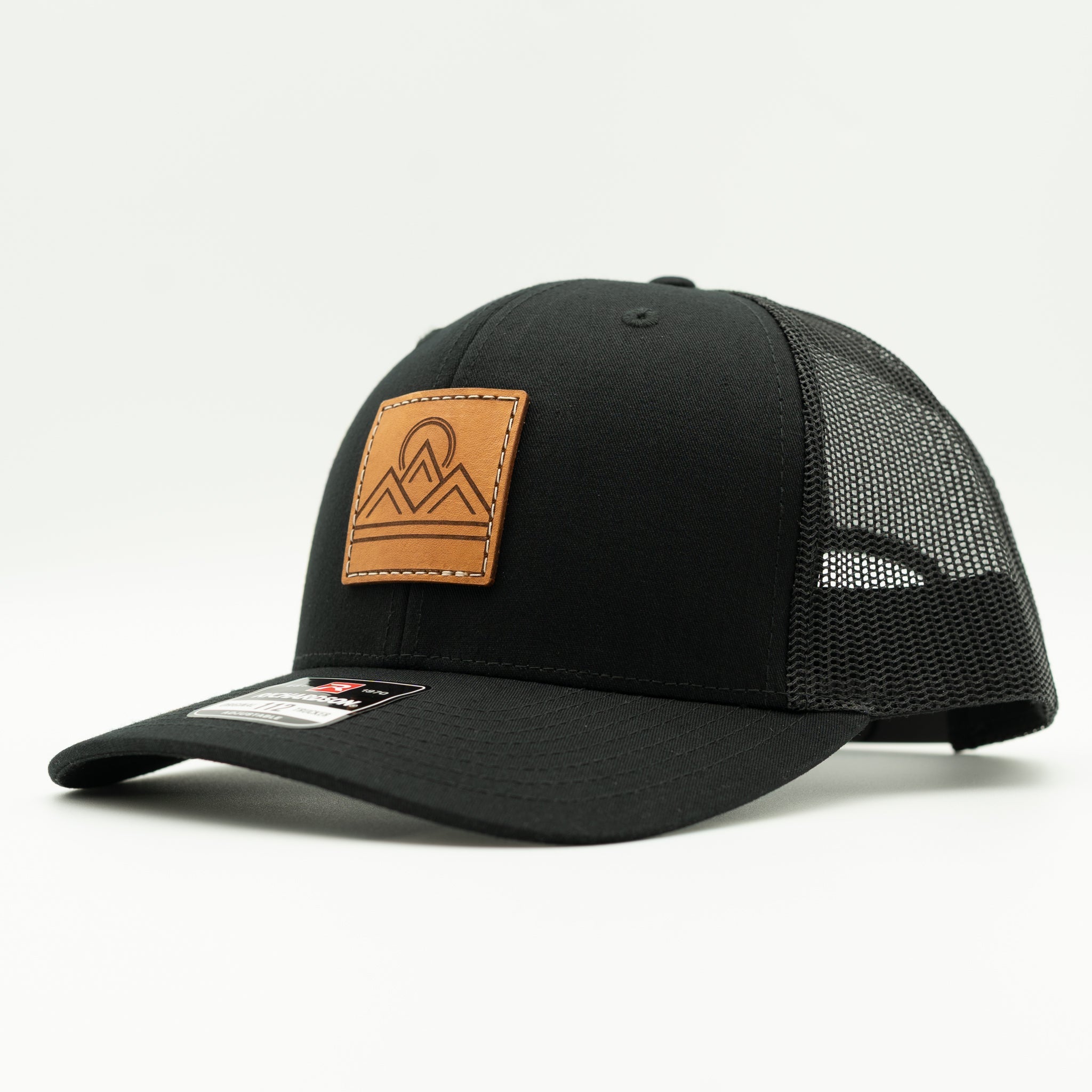 Side view of Lunar Ridge black on black Richardson 112 leather patch mountain hat with mesh back and curved bill

Color: Solid Black