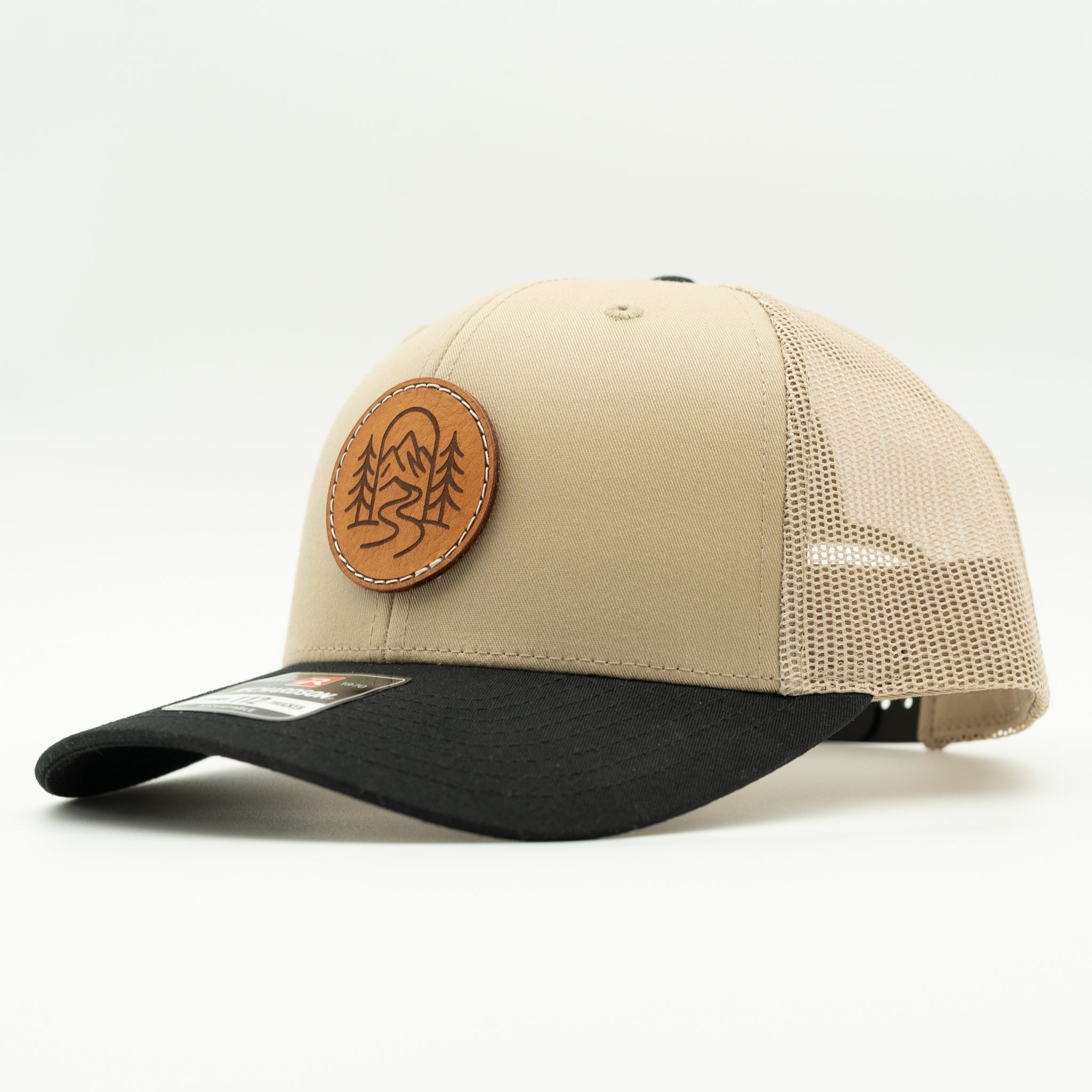 Side view of The Passage khaki and black Richardson 112 leather patch mountain hat.