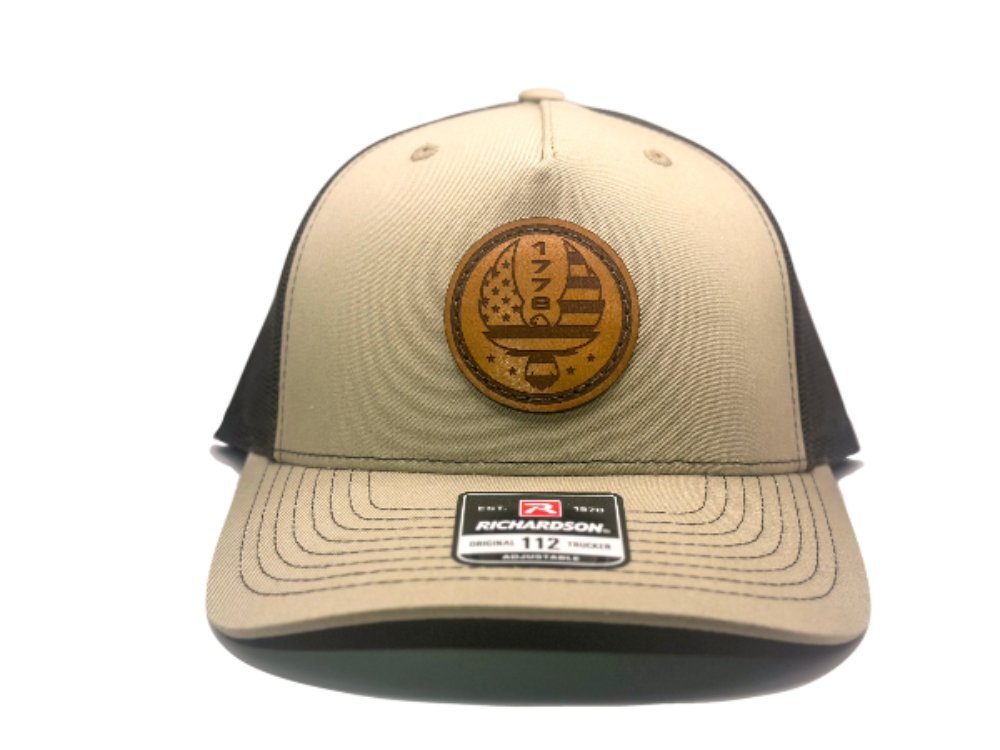 Custom Khaki/Brown Richardson Leather Patch hat. Our custom designed leather patch is laser engraved and sewn onto a Richardson 112 Hat. We use full-grain, veg tanned leather. Our custom leather patches are handmade and designed in Colorado, USA