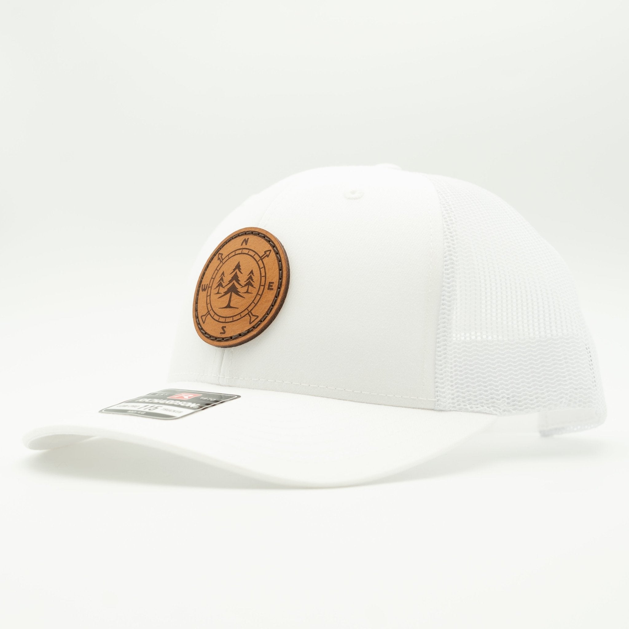 White cap with a brown leather patch featuring a tree design on a white background

Color: Solid White