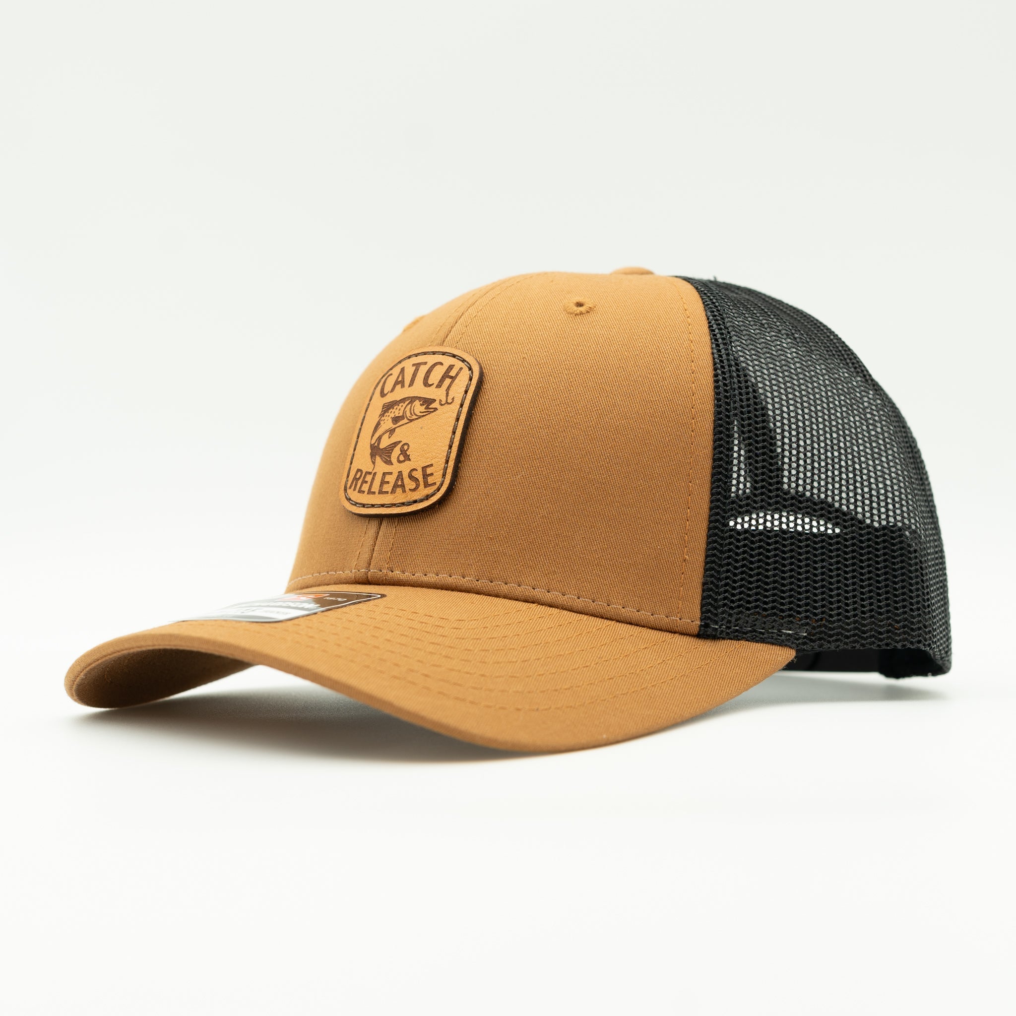 Side view of caramel and black Richardson 115 low profile leather patch fishing hat with Catch & Release design.

Color: Caramel/Black