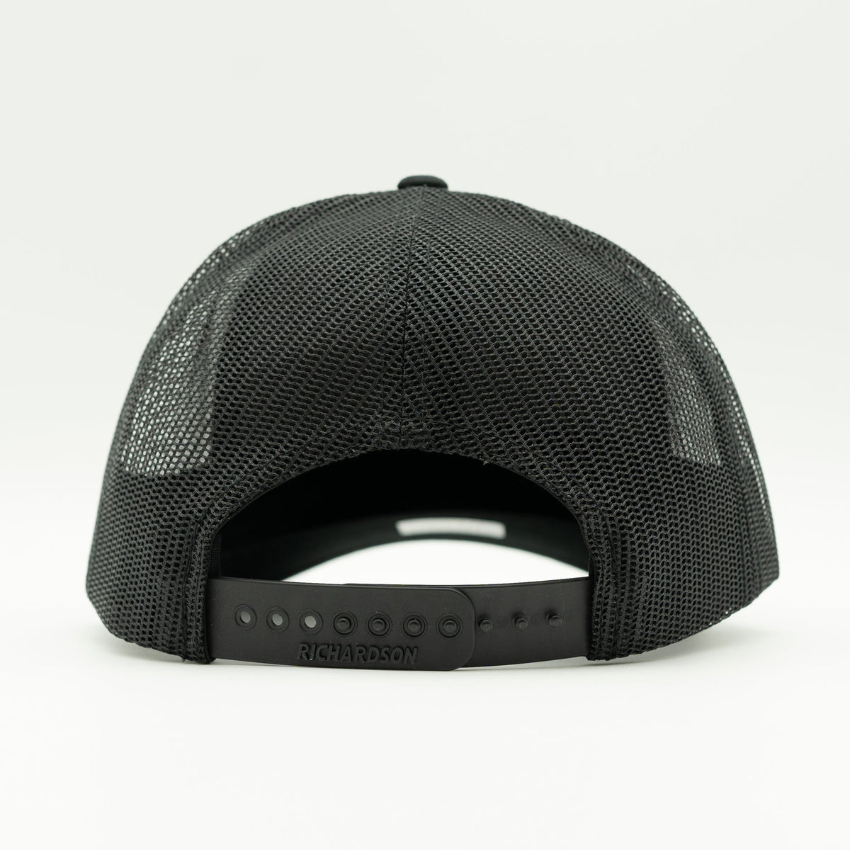 The back view of a black mesh trucker hat with an adjustable snapback closure, shown on a clean white background.

Color: Loden/Black