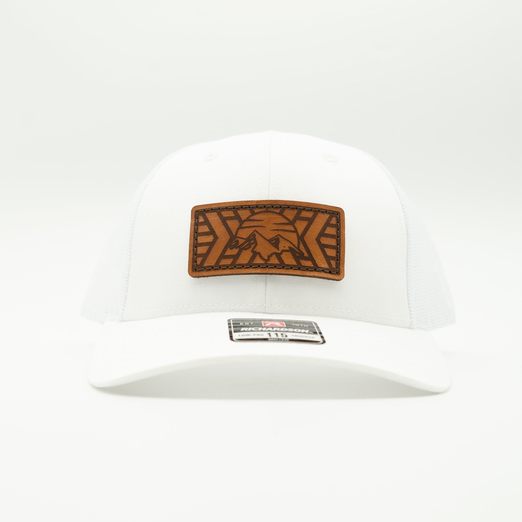 White cap with a brown leather patch featuring a logo on a white background

Color: Solid White