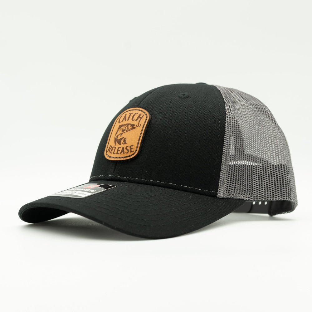 Side view of black front and light grey mesh Richardson 115 low profile leather patch fishing hat with Catch & Release design.

Color: Black/Charcoal