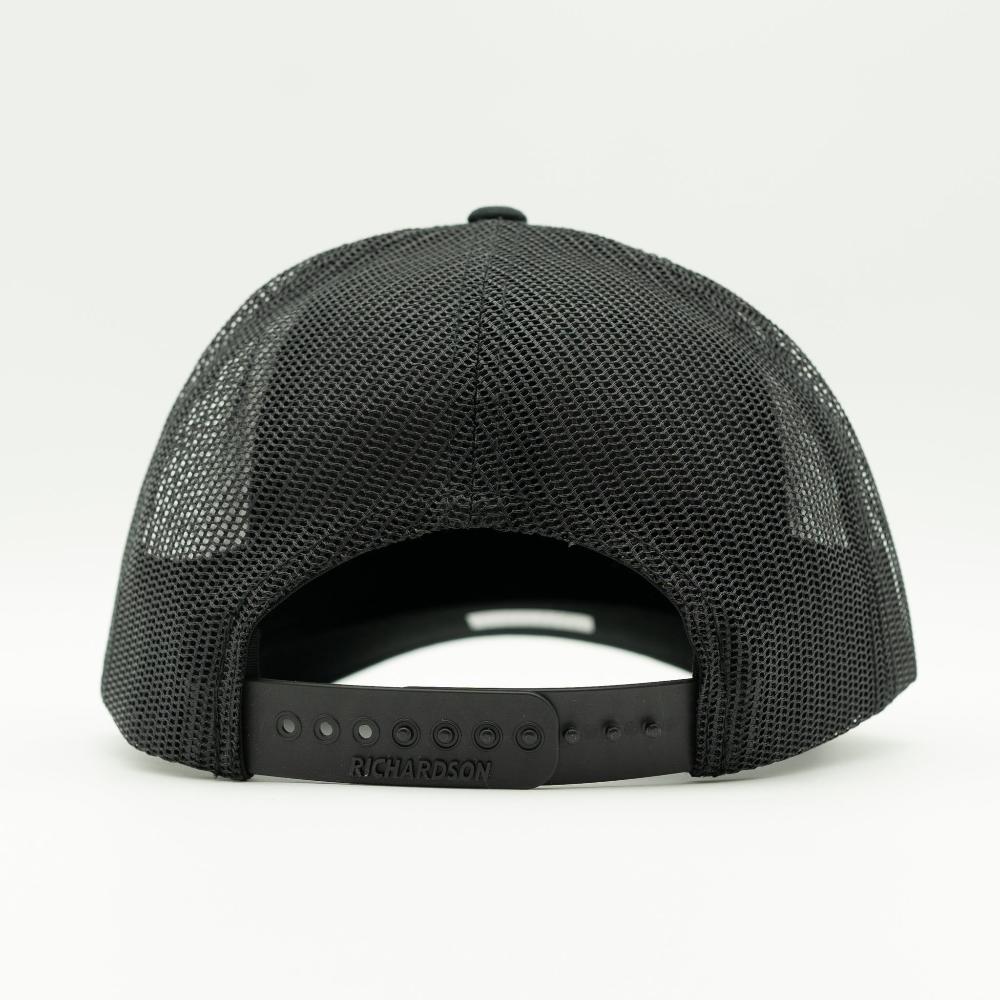 Back view of charcoal and black Richardson 112 Dark Mountain hat, showing black mesh back and plastic adjustable snapback closure, a mid profile mountain hat with leather patch for daily use.