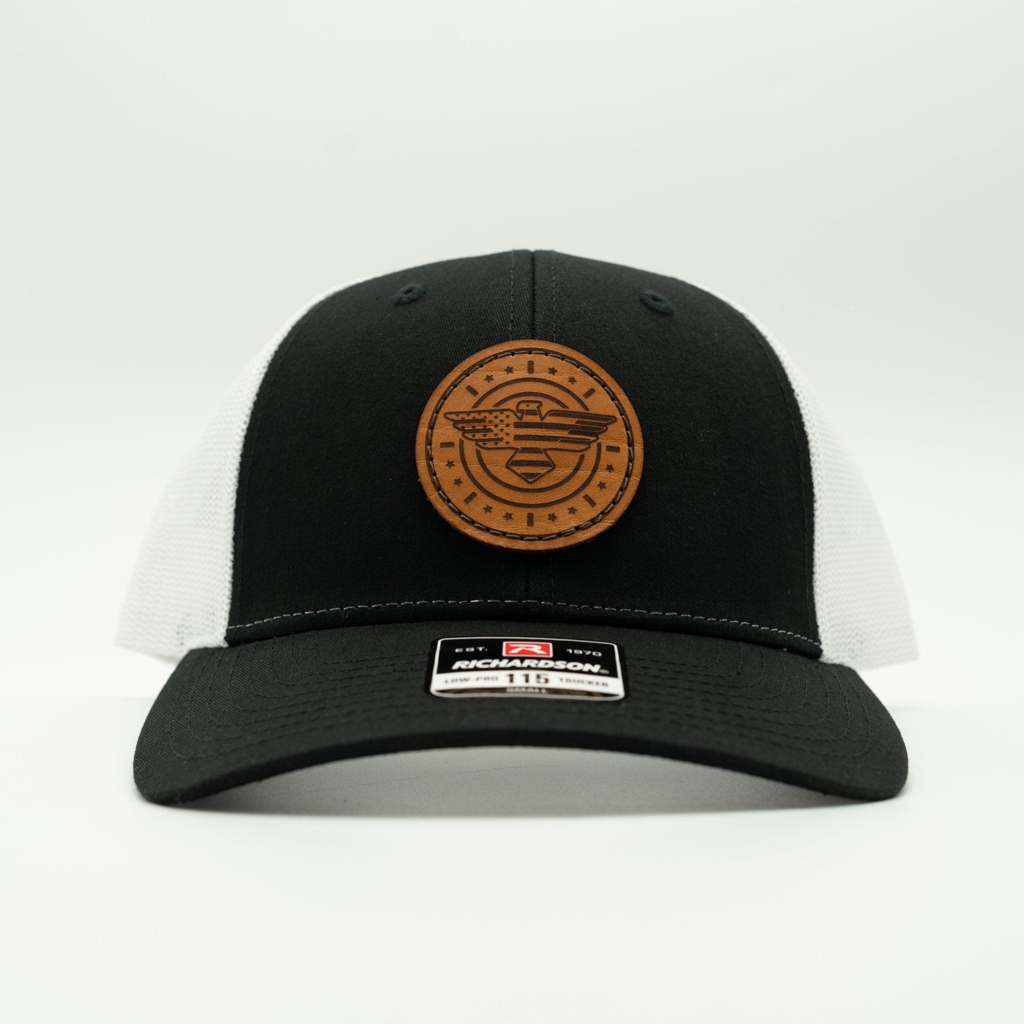 Black and white cap with a brown leather patch on a light gray background

Color: Black/White