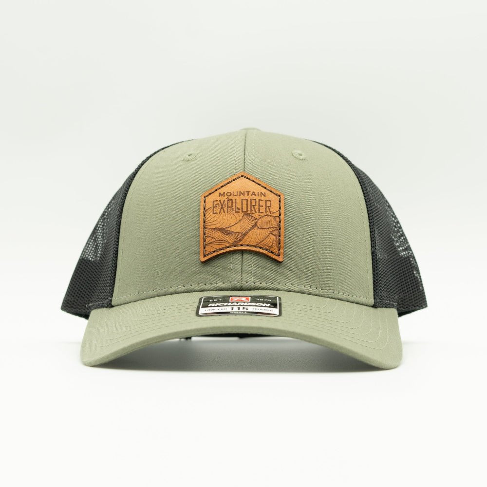 Front view of loden and black Mountain Explorer leather patch hat, low profile Richardson 115 mountain hat with sewn real leather patch for hiking and camping days