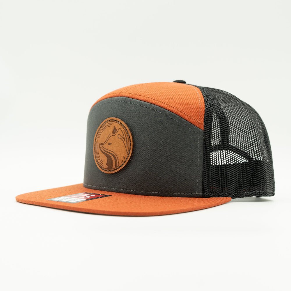 Side view of charcoal and orange Fox Hollow Richardson 168 hat, showing fox leather patch, bold orange flat bill, and mesh back.

Color: Charc/Orange/Black 168 (OSFM)