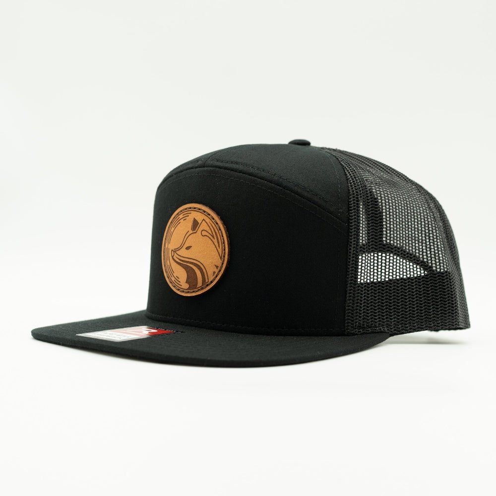 Side view of solid black Fox Hollow Richardson 168 hat, showing round fox leather patch, high profile crown, and mesh trucker back.

Color: Black/Black  168 (OSFM)