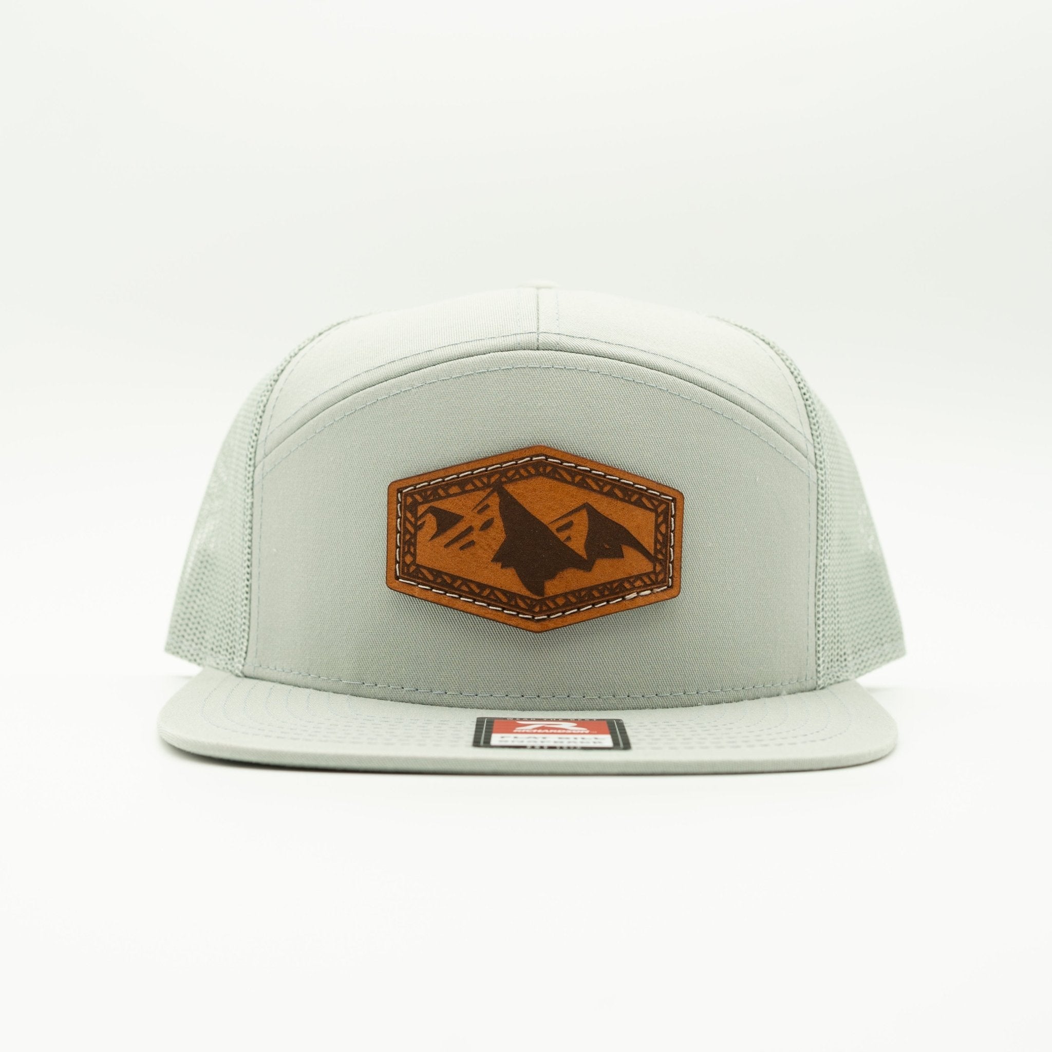 Light gray cap with brown leather patch featuring mountain design on a white background

Color: Quarry 168 (OSFM)