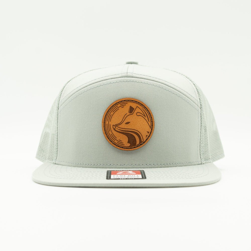 Front view of Fox Hollow leather patch hat on quarry Richardson 168 seven panel, flat bill, fox badge, and light mesh back.

Color: Quarry 168 (OSFM)